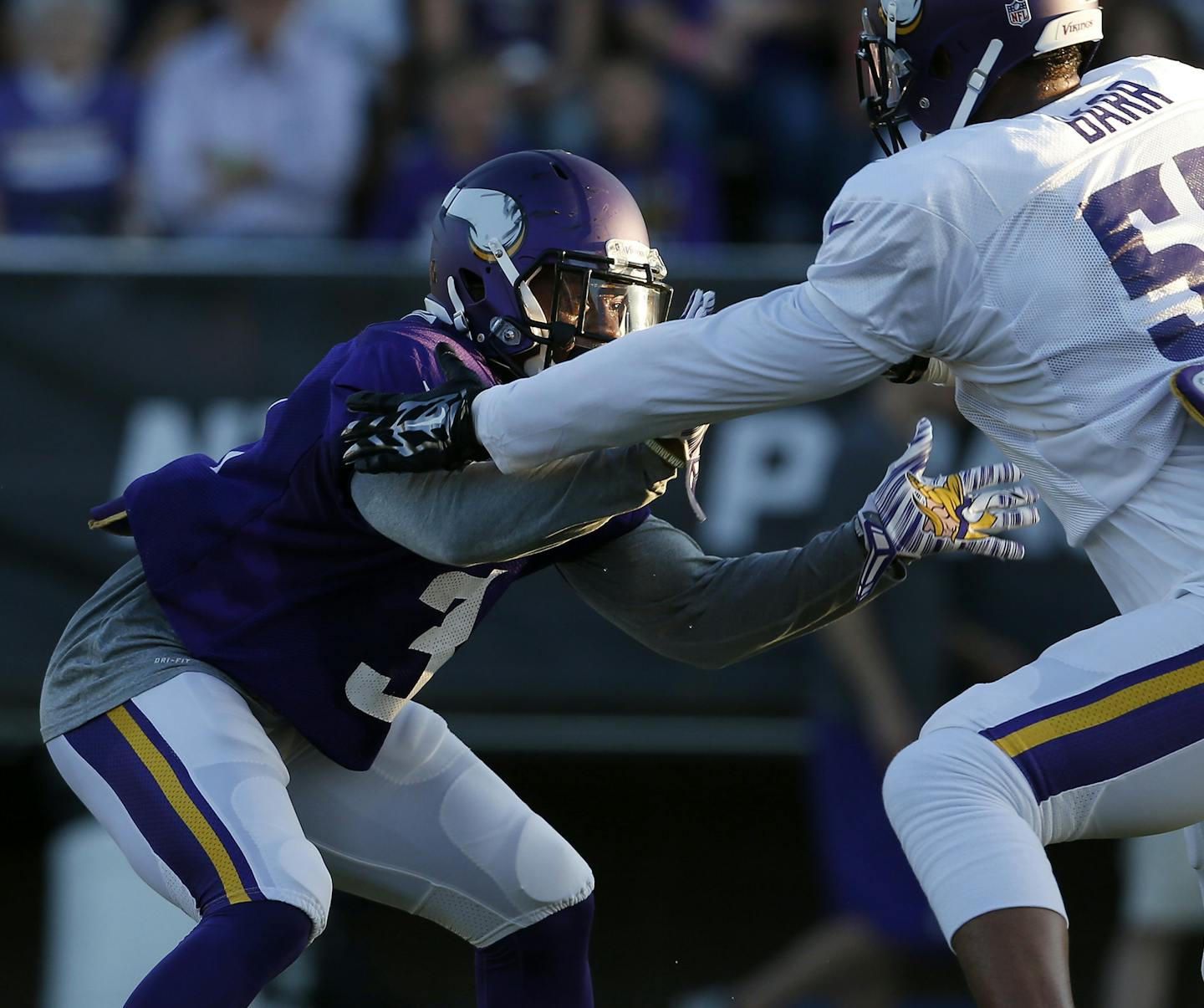 Vikings running back Jerick McKinnon tangled with linebacker Anthony Barr during a drill during training camp on Sunday.