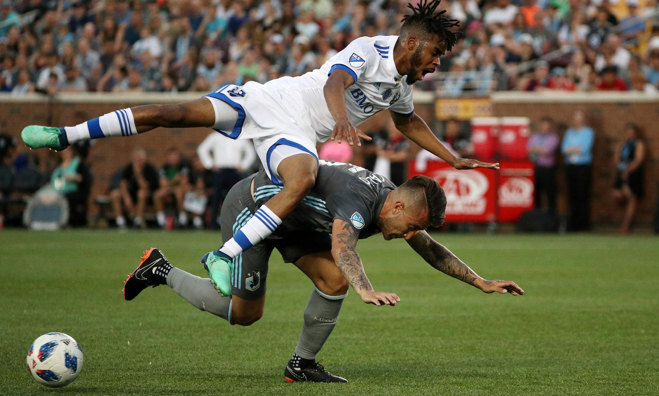 Montreal Impact forward Raheem Edwards (14) collided with Minnesota United defender Francisco Calvo (5) as he dribbled the ball in the second half. ] ANTHONY SOUFFLE ï anthony.souffle@startribune.com The Minnesota United played the Montreal Impact in an MLS match Saturday, May 26, 2018 at TCF Bank Stadium in Minneapolis.