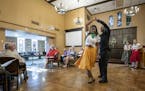 Amudalat Ajasa, 18, and Rande Tomas, 64, danced during a rehearsal for "Holding On: Unexpected Stories of World War II" at the Episcopal Homes in St