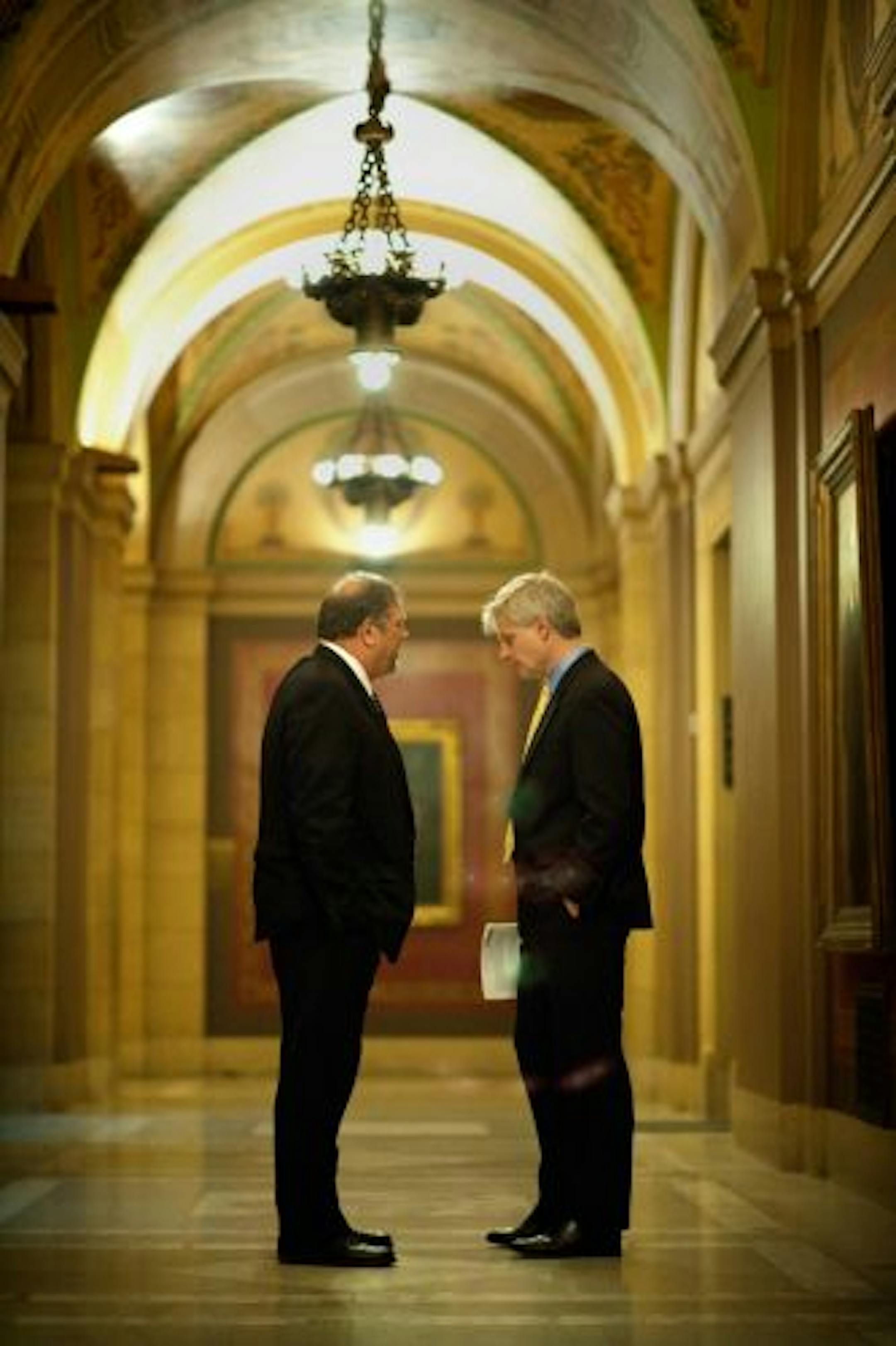 Senate minority leader Thomas Bakk and House minority leader Paul Thissen discussed strategy in the hallway before their news conference Friday where they discussed stadium and budget legislation. they spoke to reporters after the GOP leadership.