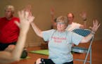 Bonnie Olson participated in a yoga class for people with Parkinson's Disease at Tarana Yoga Studio, Thursday, August 25, 2016 in Minneapolis, MN. ] (