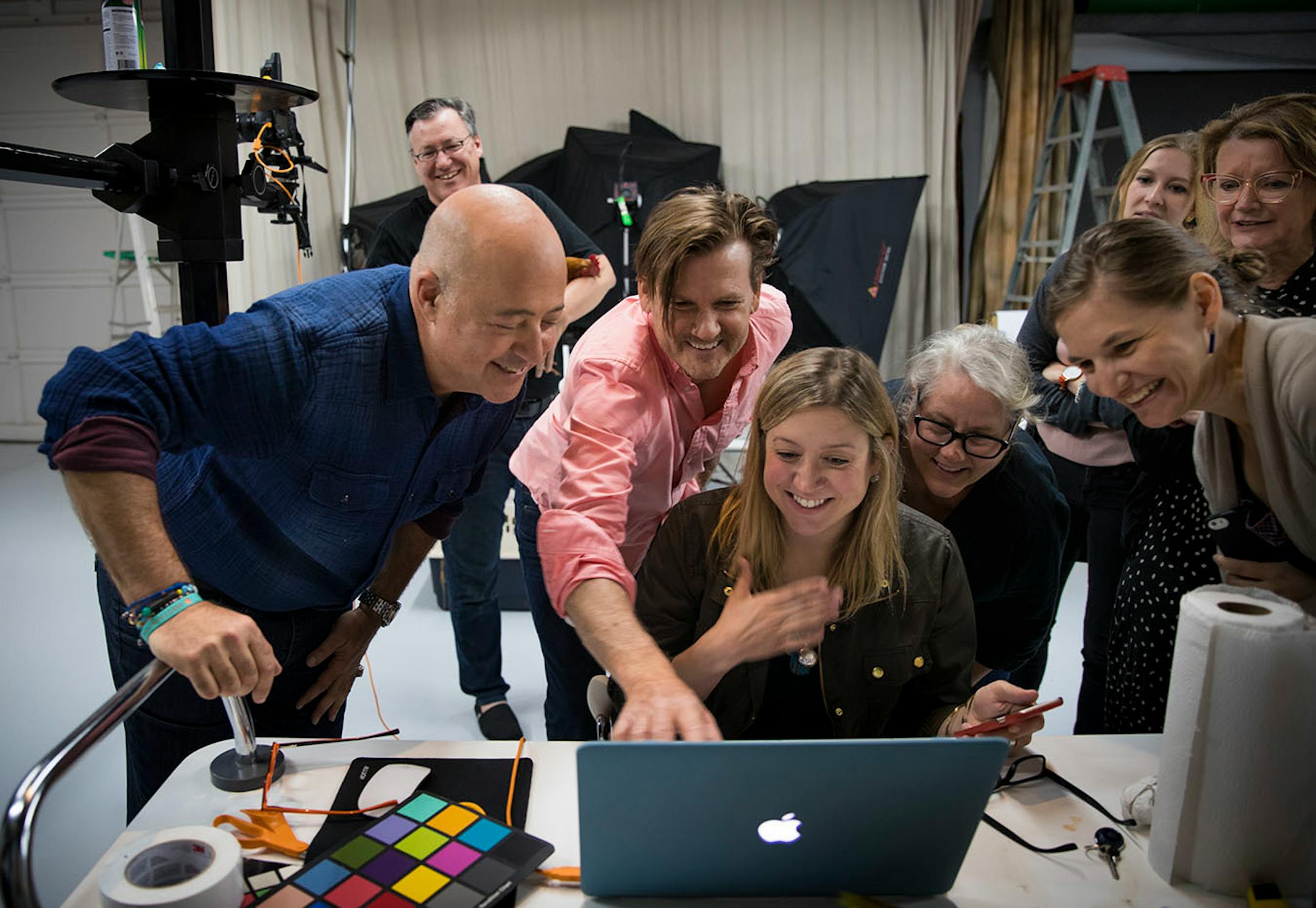 From left; Andrew Zimmern looked at the results of a photoshoot for Midwest Living with photographer Steve Henke, Kylee Krizmanic, Mary Jo Hoffman, Hannah Agran, Adele Henke, and Margo Henke at Steve Henke Studio in Golden Valley on May 26, 2017.