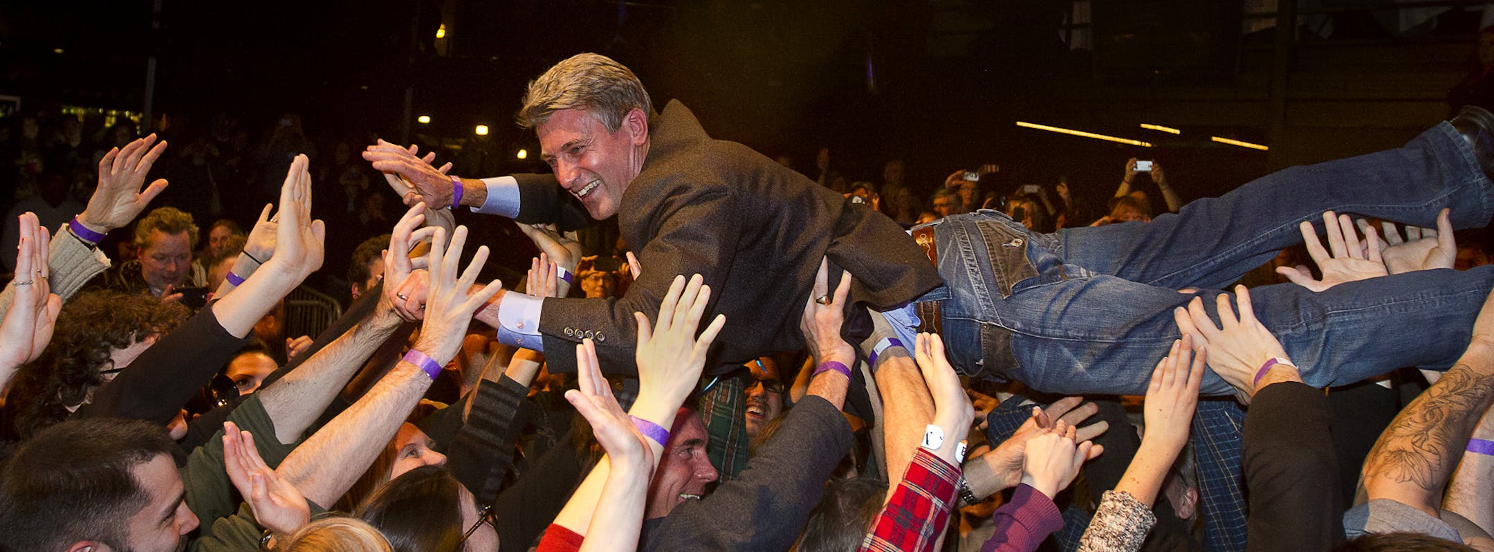 Minneapolis Mayor R.T. Rybak crowd surfs on his supporters after a short speech during his "Unauguration Party" at First Avenue, Wednesday, December 18, 2013.