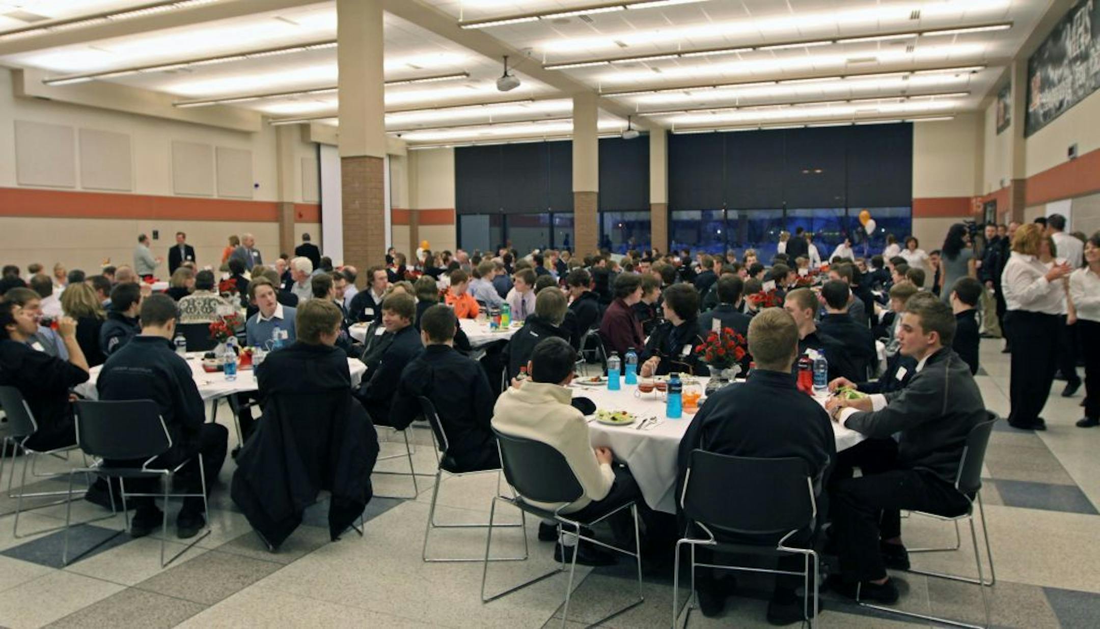 (left to right) Several hundred players and coaches from Moorhead, Wayzata and Hill Murray gathered at Moorhead high school for the 2011 Minnesota Hockey Day banquet.