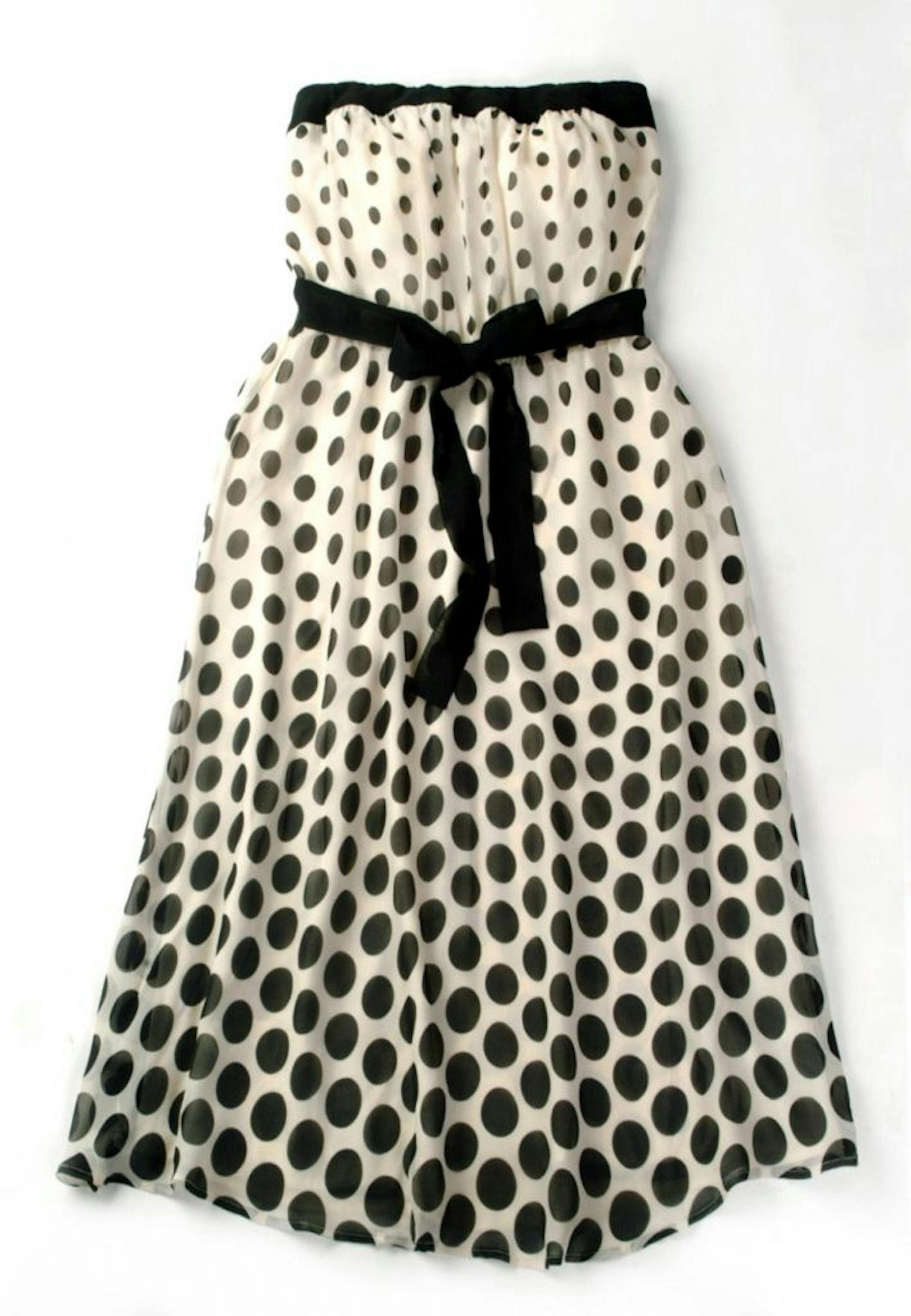 Dressing on the dot: Strapless polka dot dress in black and white with ribbon tie.