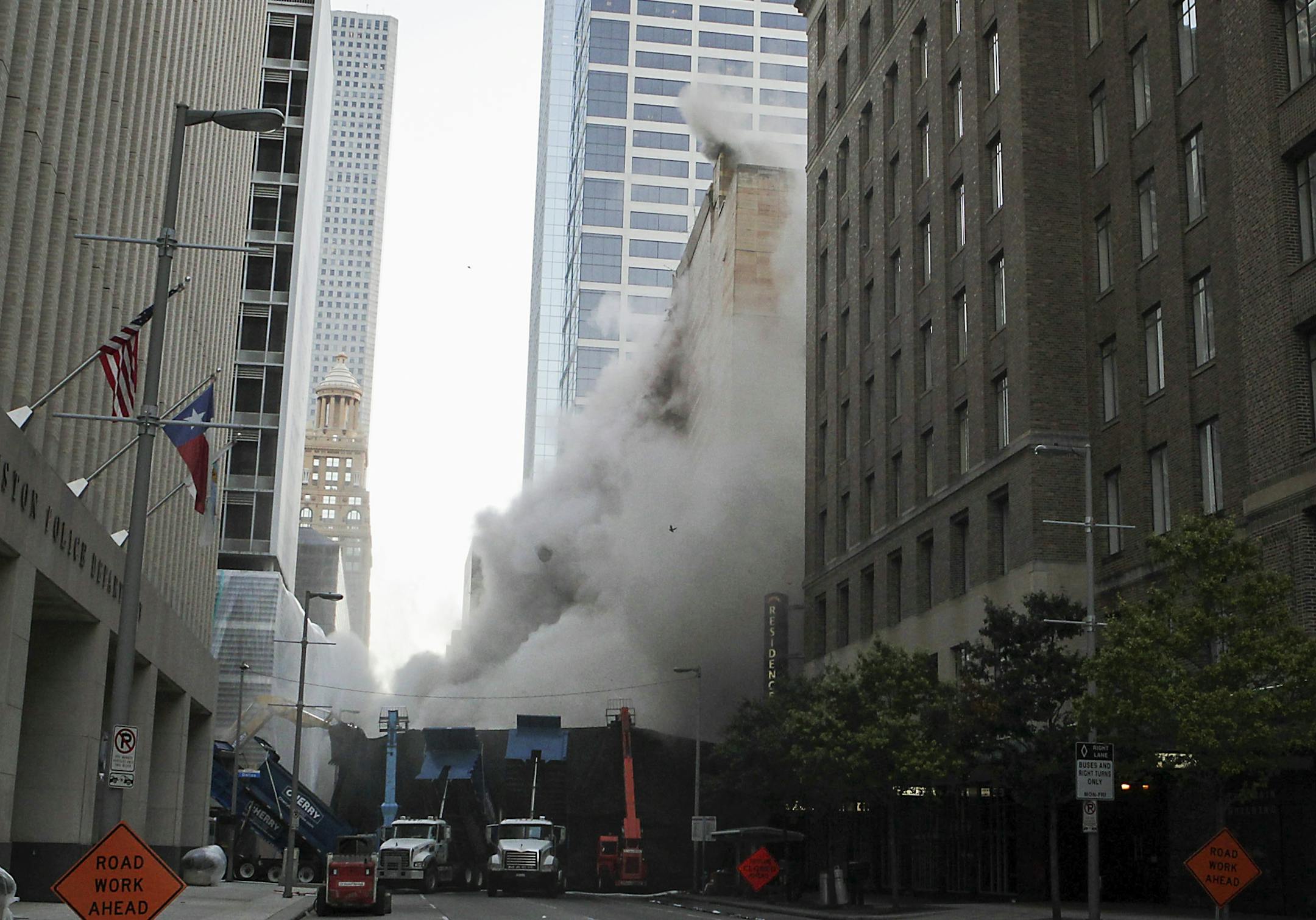 A series of explosive charges brings down the landmark former Macy's department store building in downtown Houston on Sunday, Sept. 22, 2013. Many Houstonians remember the store as Foley's, a homegrown retail chain that started downtown in 1900 and moved into the building in 1947. It was converted to Macy's in 2006 and operated at the site until closing in March. The 10-story, 791,000-square-foot building was reduced to rubble just after sunrise to make way for a still-undisclosed new developmen