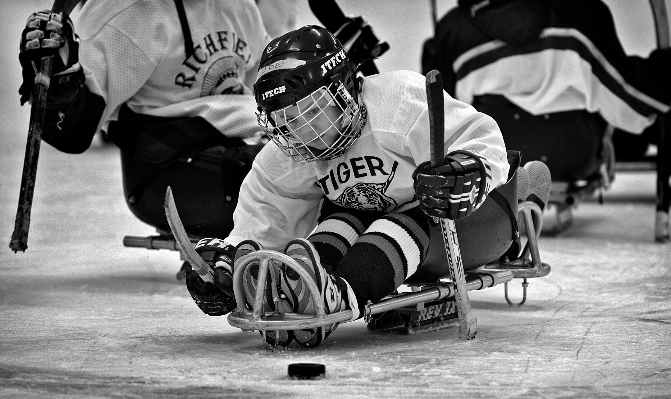 JIM GEHRZ � jgehrz@startribune.comLakeville/February 6, 2010/10:00 AM ] Eight-year-old Joe Lang, Loretto, loves hockey, a game he has played ever since he was three. This is Joe�s first year playing with the Minnesota Sled Hockey Association. Last year he played mites in Delano before a hemorrhage near his spinal column, likely due to a congenital condition, left him paralyzed from the abdomen and below. �He almost died,� explained his father, Tony, ��they put a tube into him to breathe because