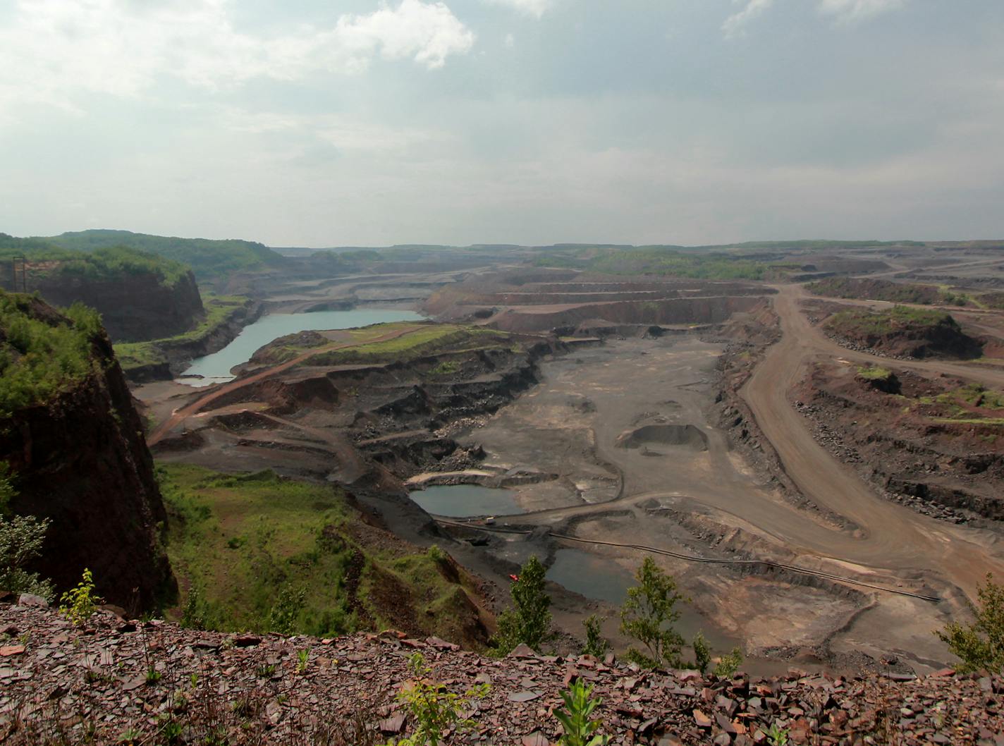 Visitors can peer into the 535-feet-deep Hull-Rust-Mahoning open-pit iron mine in Hibbing, Minn., which is a National Historic Landmark.