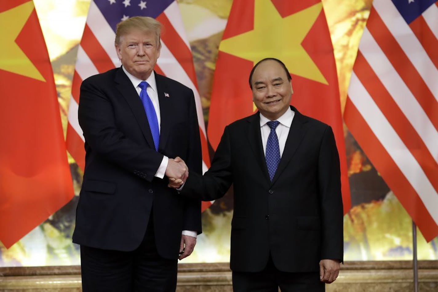 President Donald Trump meets with Vietnamese Prime Minister Nguyen Xuan Phuc at the Office of Government Hall, Wednesday, Feb. 27, 2019, in Hanoi.