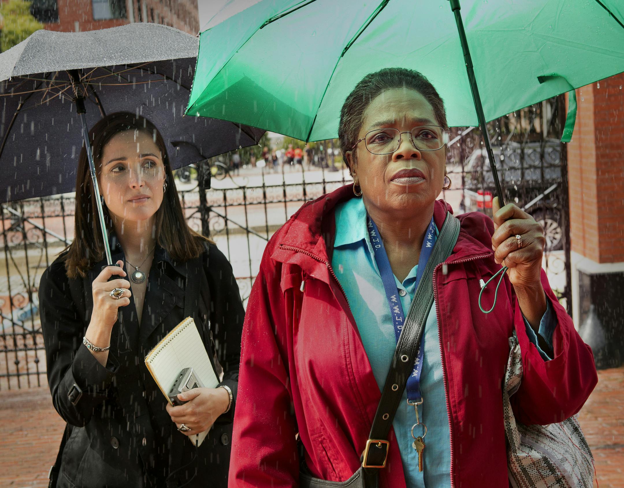 This image released by HBO shows Rose Byrne, left, and Oprah Winfrey in a scene from HBO film "The Immortal Life of Henrietta Lacks," premiering Saturday at 8 p.m. EDT. (Quantrell Colbert/HBO via AP)