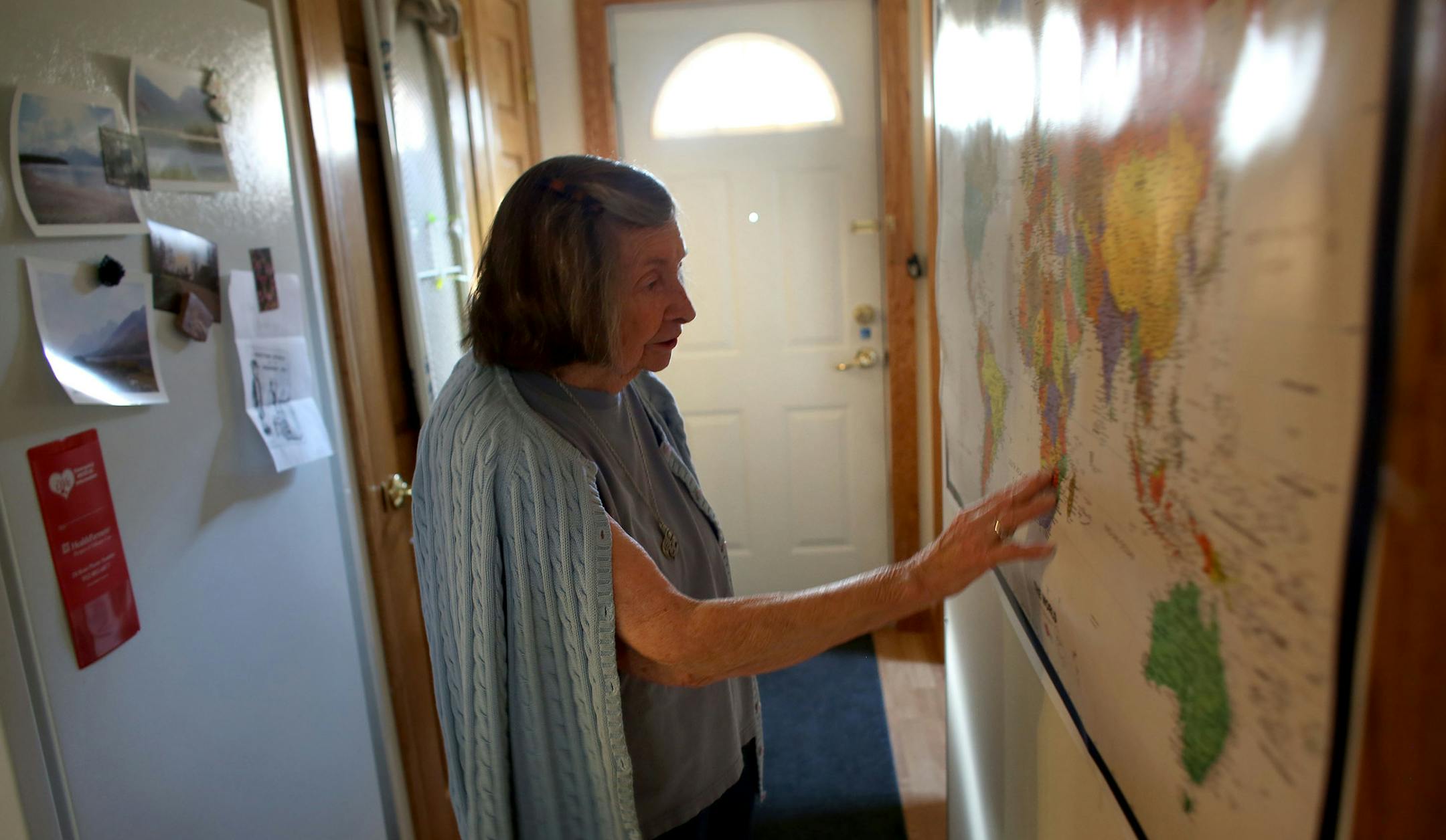 Mary Lou Hill, 97, who has traveled a lot in her life liked having a wall map to reference when reading current events. ] (KYNDELL HARKNESS/STAR TRIBUNE) kyndell.harkness@startribune.com in Minneapolis Min., Tuesday, October 21, 2014.