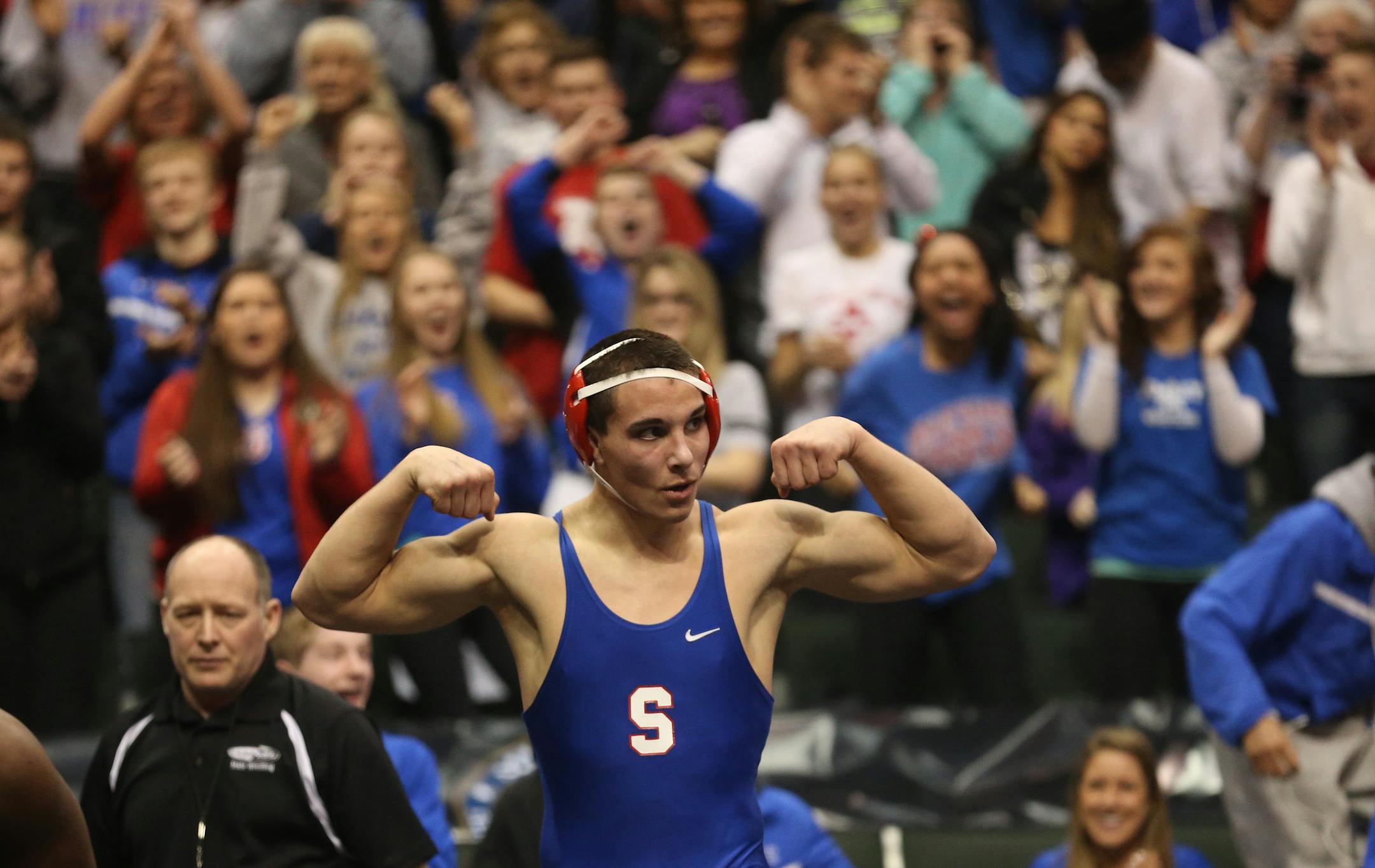 Simley's Chris Bauman celebrated beating Scott West's Ray Carter in the 195 weight class. (Kyndell Harkness/Star Tribune)