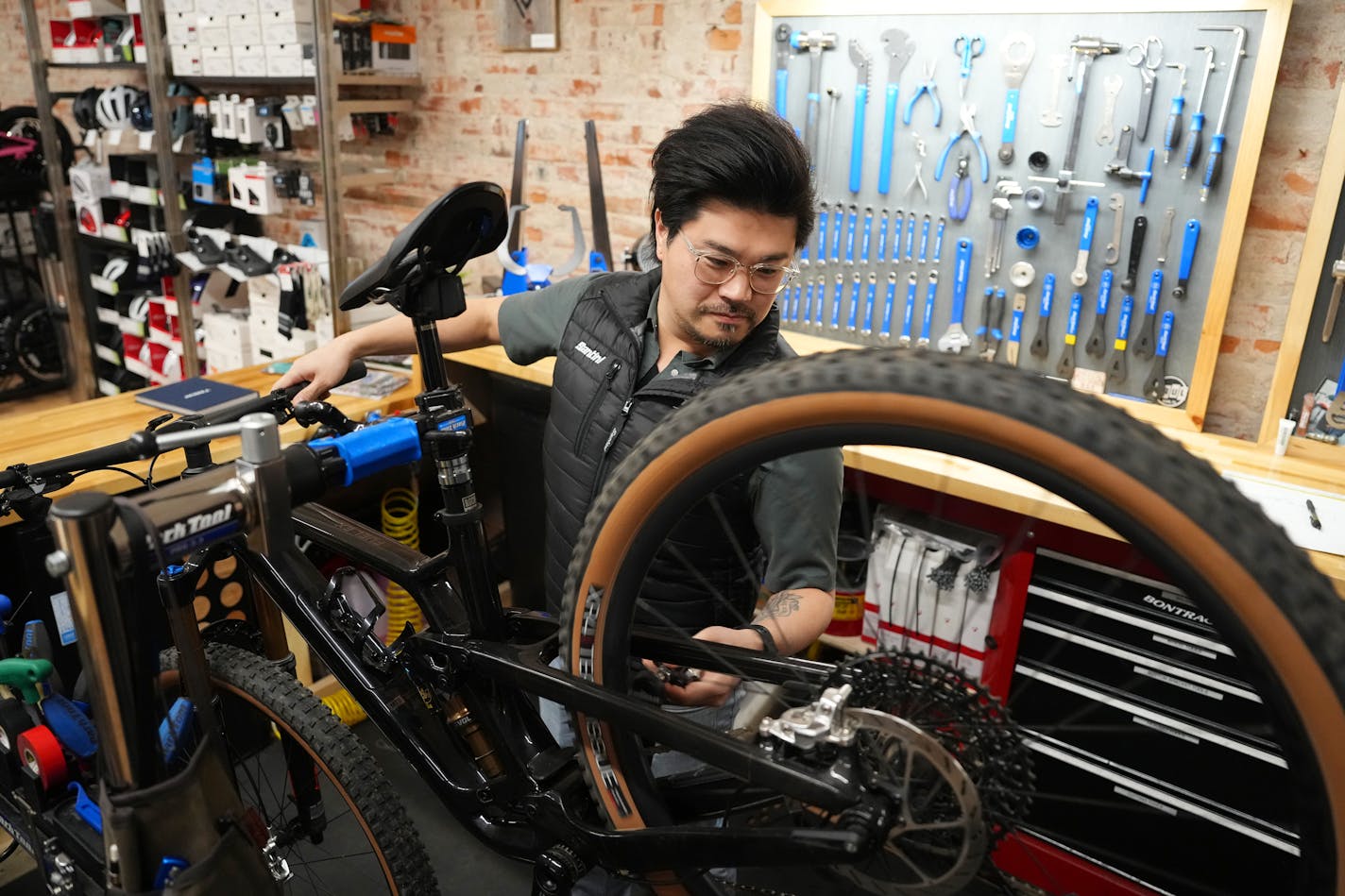 Andrew Petersen, owner of the Red Wing Bicycle Co., trued a wheel at his shop in Red Wing, Minn.