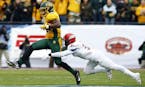 North Dakota State running back King Frazier (22) carries the ball as Jacksonville State safety DeBarriaus Miller (31) tries to make the tackle during
