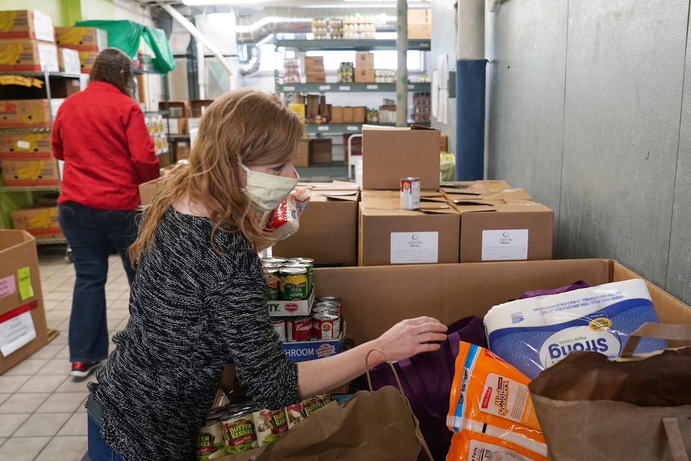 The Community Emergency Service is seeing high usage of its foodshelf as workers are either not called back yet or are getting fewer hours. (ANTHONY SOUFFLE/Star Tribune)