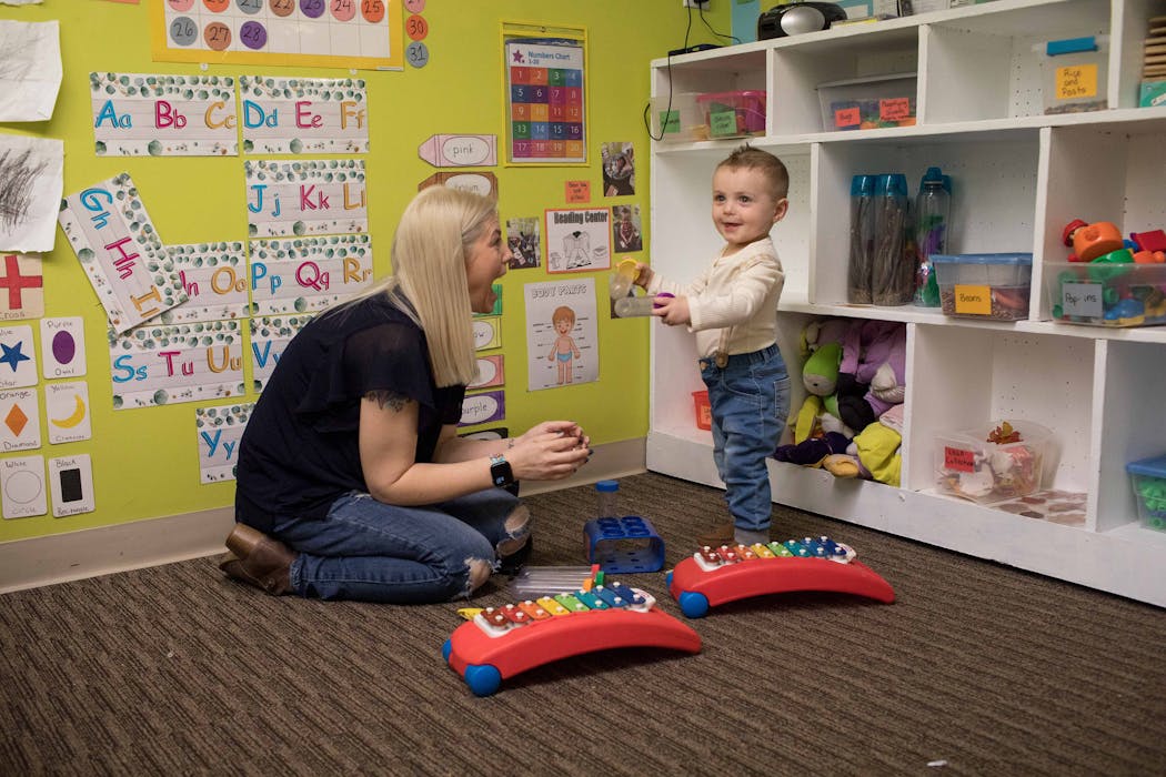 Tammy Cunningham played with son Calum at a day care center in Kokomo, Ind. 