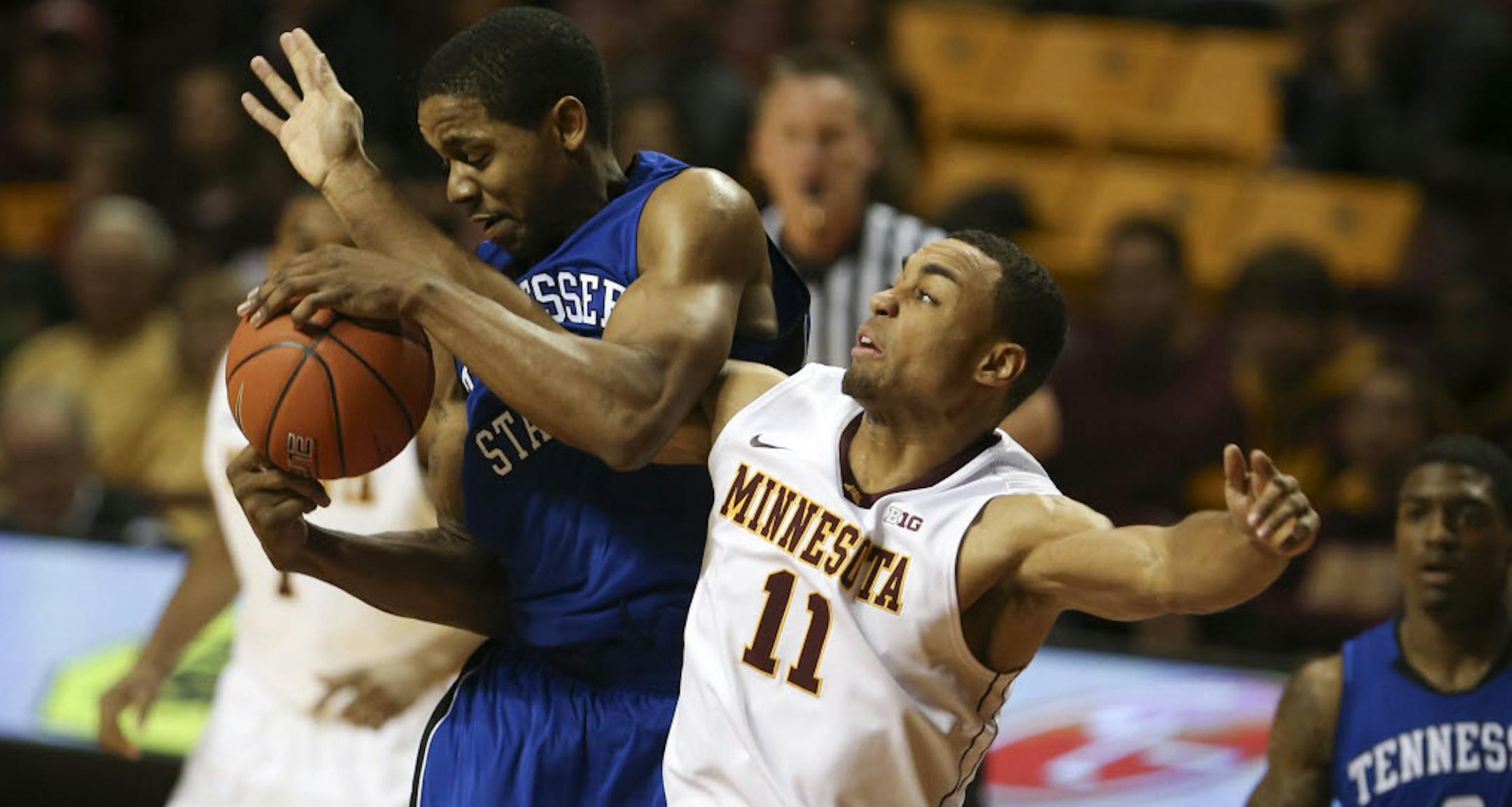 Minnesota's Joe Coleman fouled Tennessee State's Kellen Thornton.