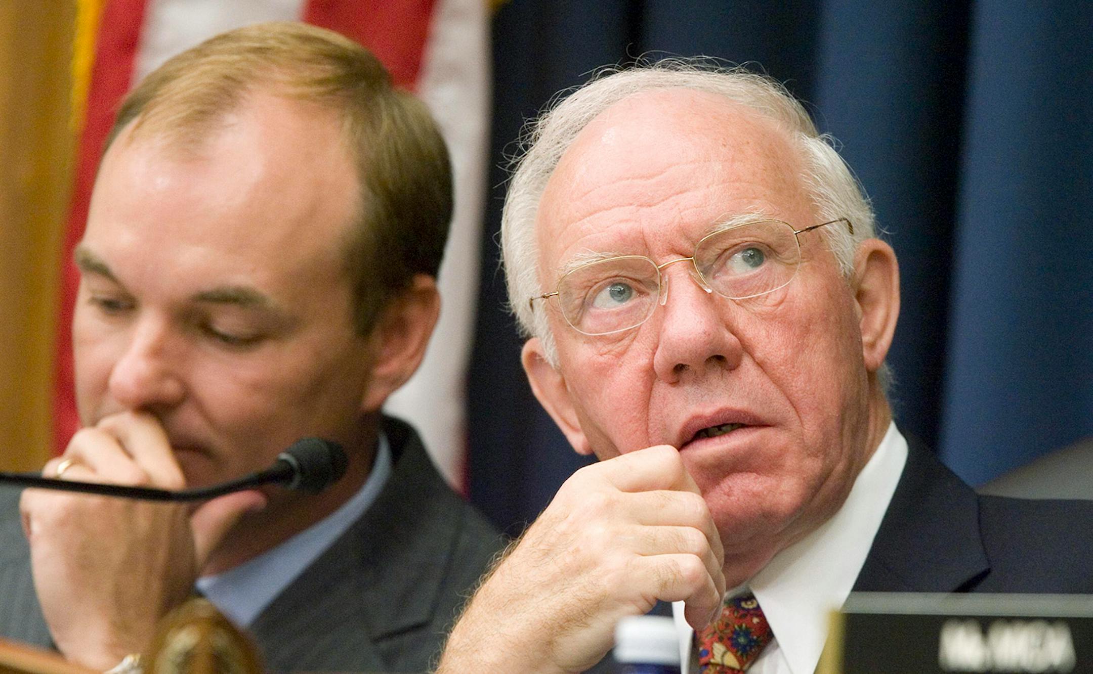 House Transportation Committee Chairman Rep. James Oberstar, D-Minn, right, confers with an unidentified counsel, during the committee's hearing on fixing our nation's structurally deficient bridges, Wednesday, Sep. 5, 2007, on Capitol Hill in Washington. (AP Photo/Manuel Balce Ceneta) ORG XMIT: DCMC103