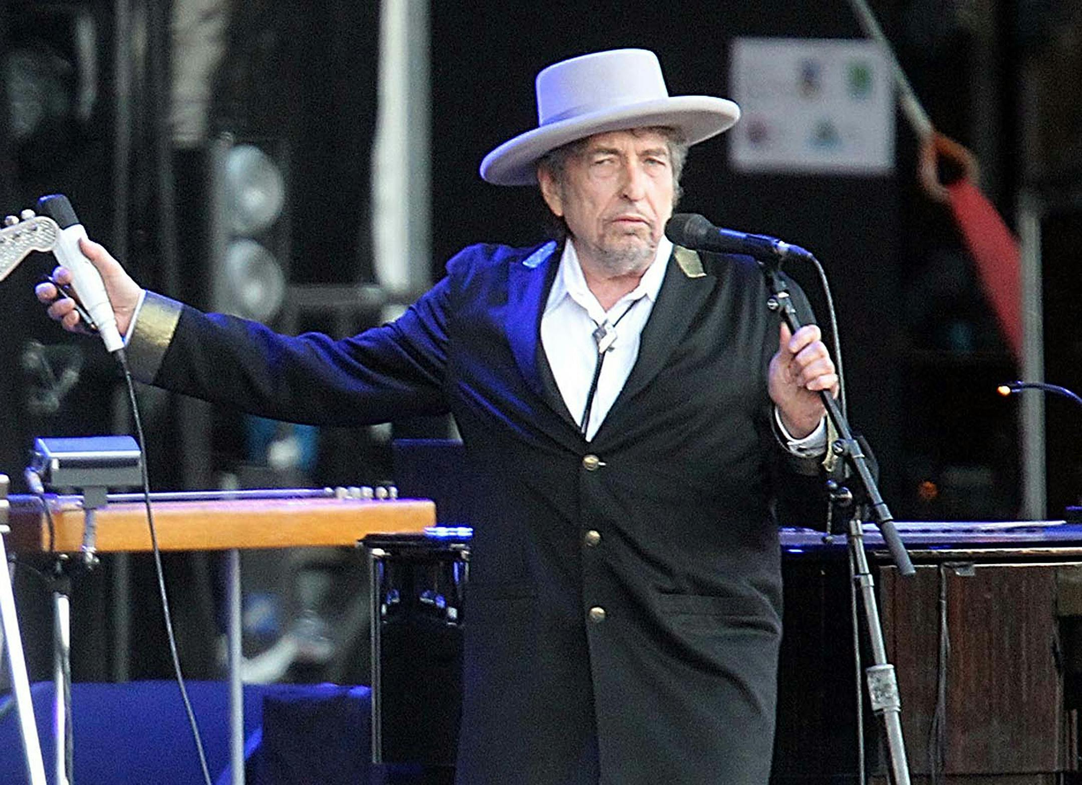 FILE - This July 22, 2012 file photo shows U.S. singer-songwriter Bob Dylan performing on stage at "Les Vieilles Charrues" Festival in Carhaix, western France. French authorities have filed preliminary charges against Bob Dylan over an interview in which he is quoted comparing Croatians to Nazis and the Ku Klux Klan. Paris prosecutor‚Äôs office spokeswoman Agnes Thibault-Lecuivre said Monday the charges of ‚Äúpublic insult and inciting hate‚Äù w
