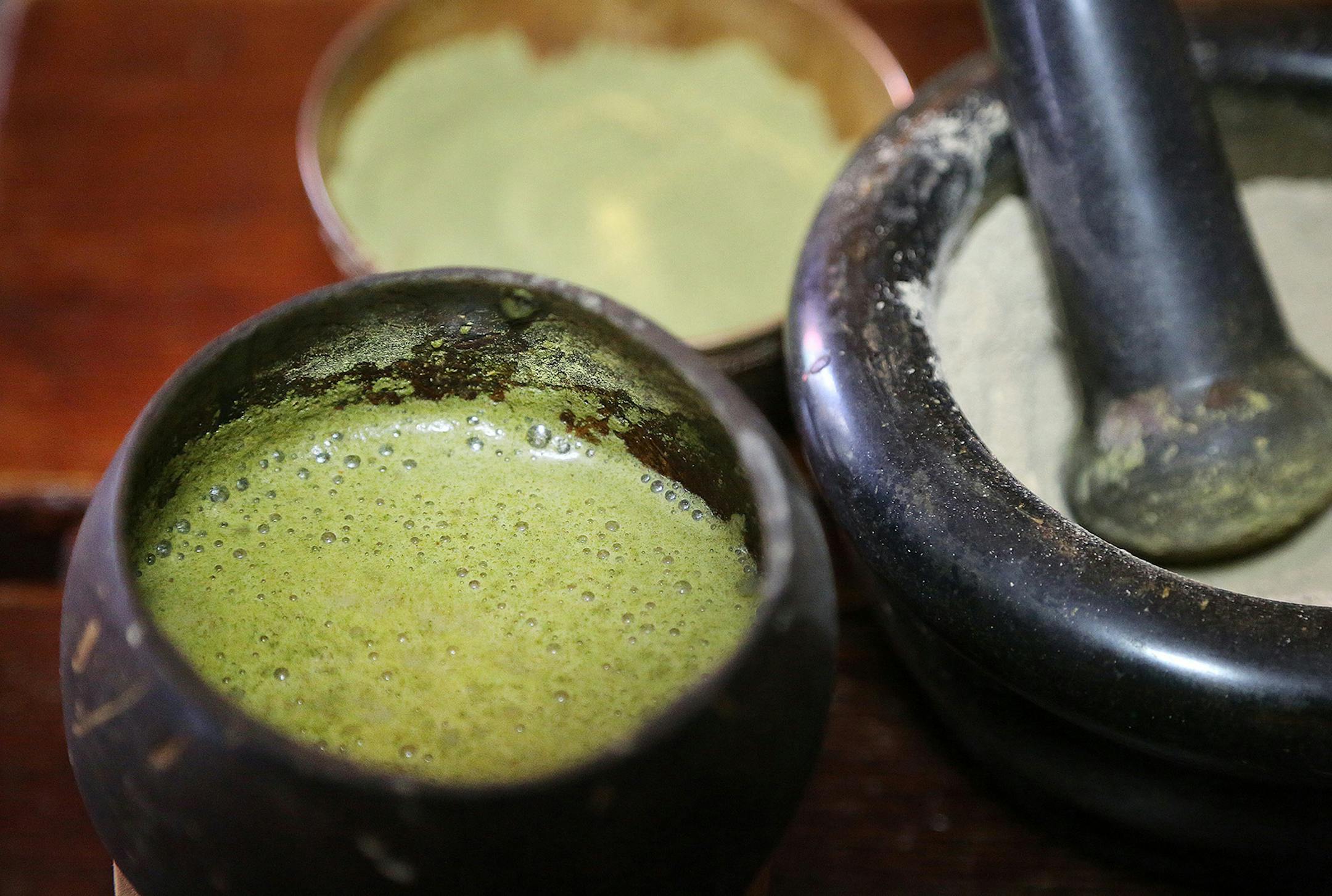 The green foam on the left is a mixture of Kava and Kratom served at Purple Lotus Kava Bar in West Palm Beach. Palm Beach County commissioners Tuesday chose to ask retailers to put up signs warning about kratom. (Carline Jean/Sun Sentinel/TNS)