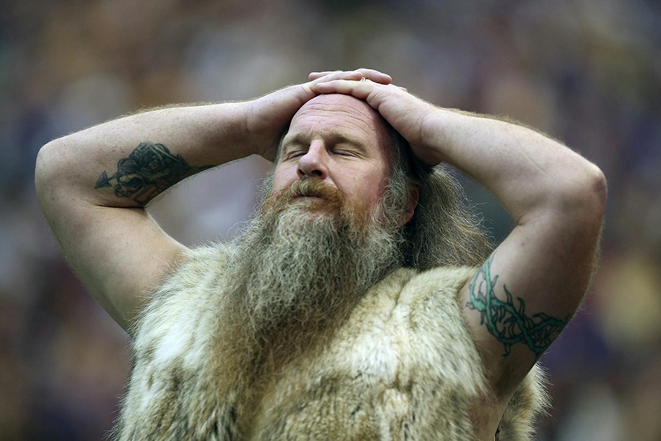 The Vikings' mascot, Ragner, aka Joseph Juranitch, averted his eyes from the field as the Vikings' headed towards a loss in 2013 to the Carolina Panthers in Minneapolis.