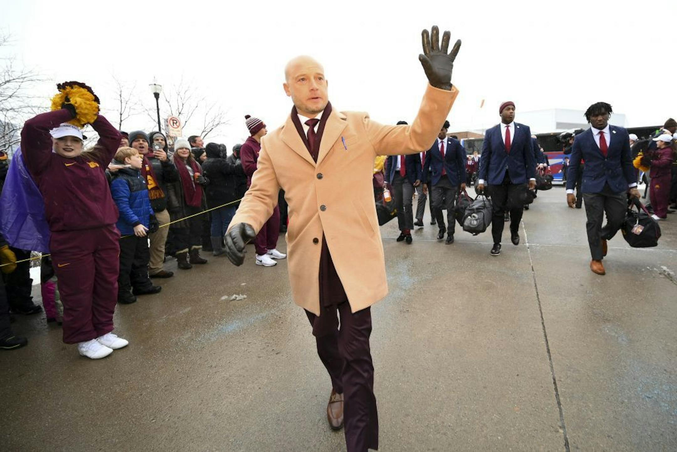 Minnesota Gophers head coach PJ Fleck greeted fans as the team arrived outside TCF Bank Stadium Saturday.