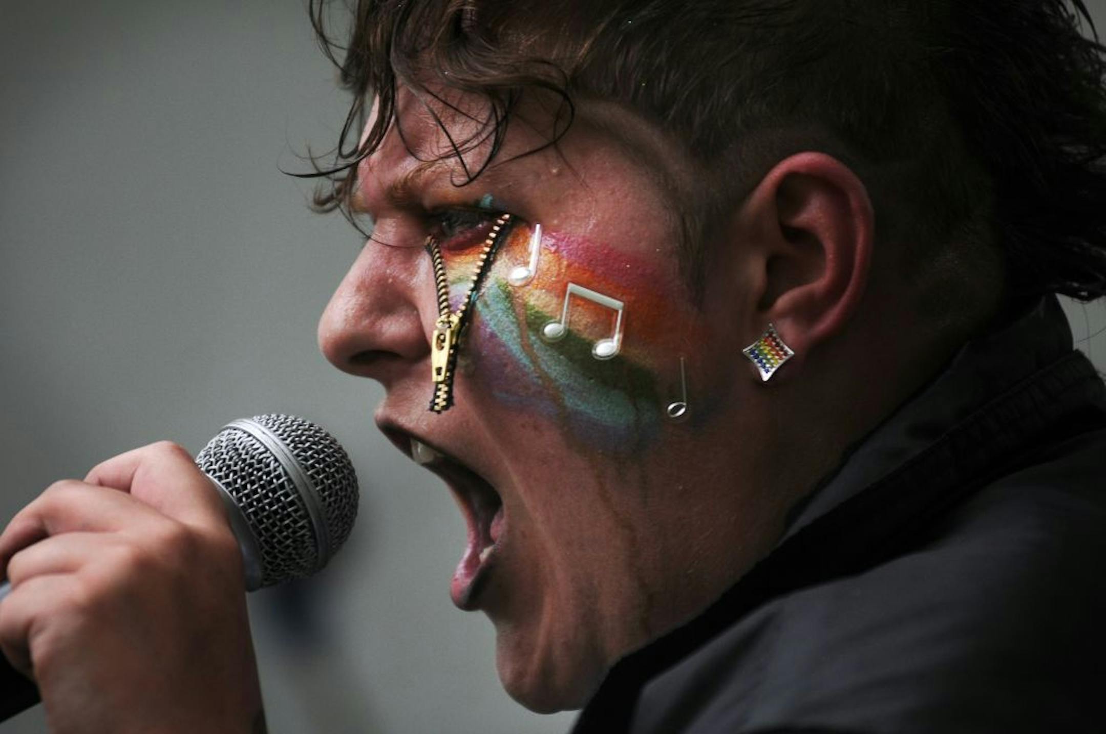 Tonya Leffler of Kaotic Muzik rapped for an audience during the first day of the Twin Cities Pride festival in Loring Park. Hundreds of people attended, enjoying food, games, music and an assortment of activities and booths.