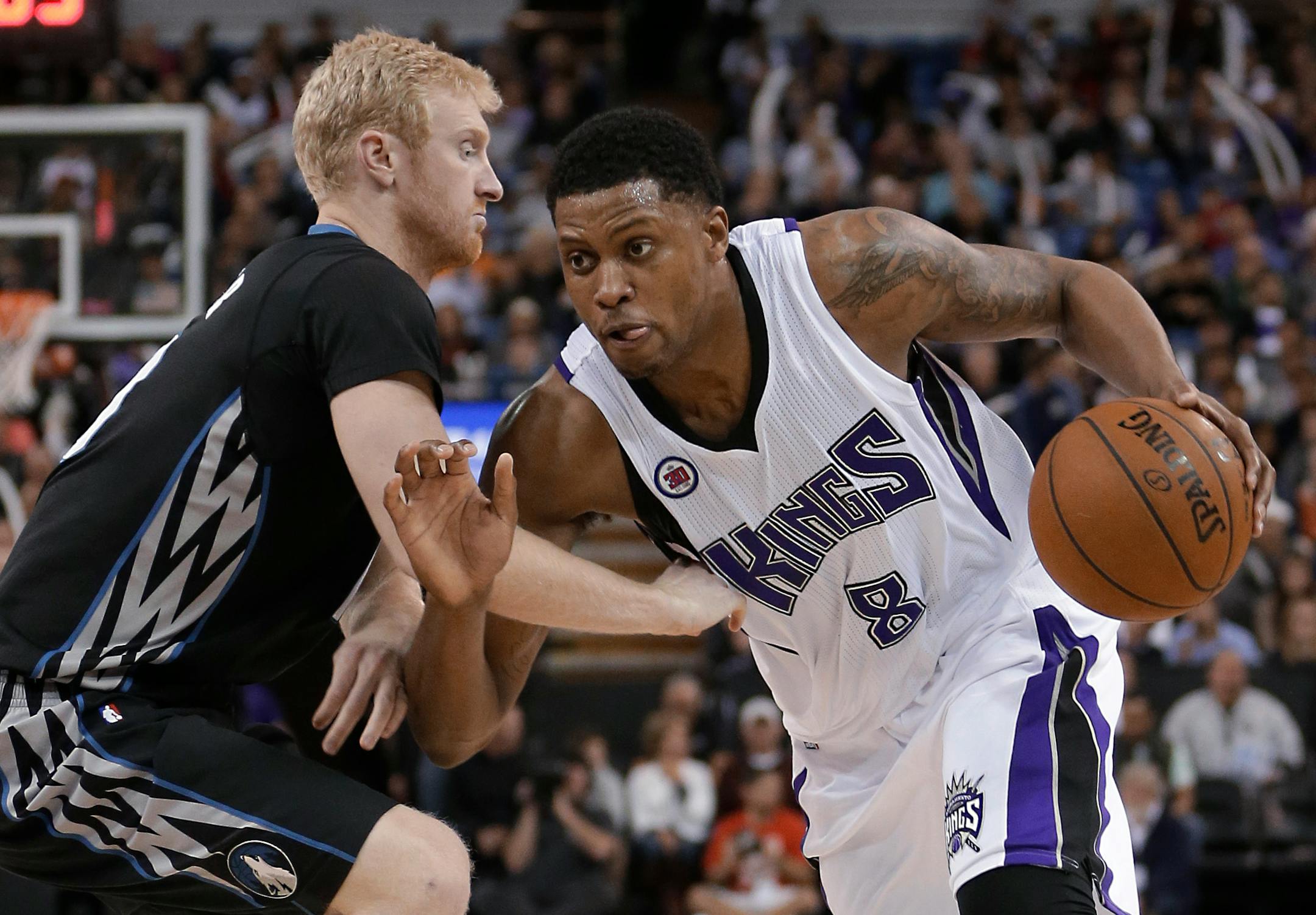 Kings forward Rudy Gay drove against Wolves forward Chase Budinger during the second half of Sacramento's 116-105 victory Tuesday night.