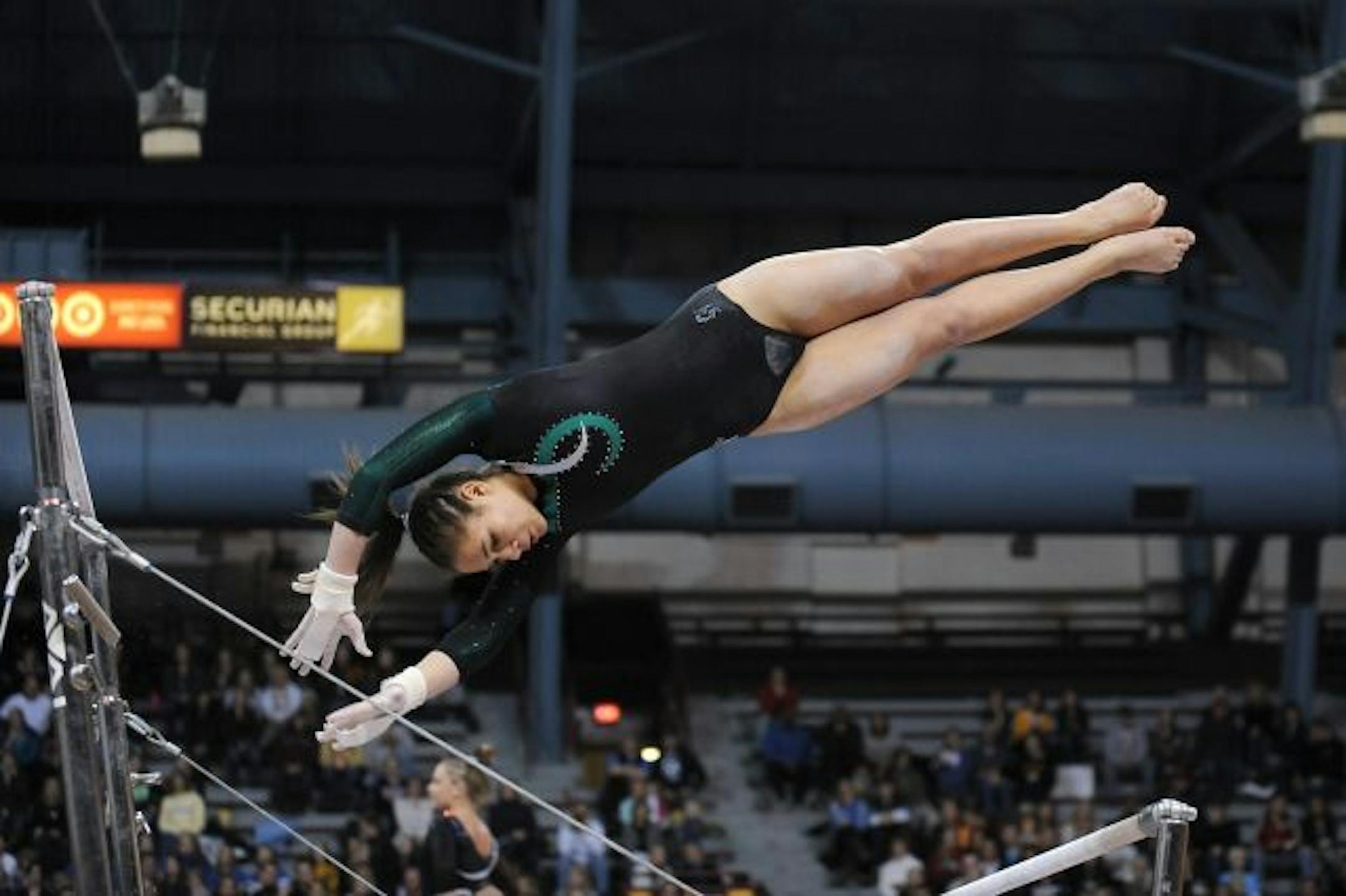 Cottage Grove's Kasondra Tulloch competed on the uneven parallel bars during a Minnesota State Girls Gymnastics tournament on February 26th at the Sports Pavilion in Minneapolis, Minn.