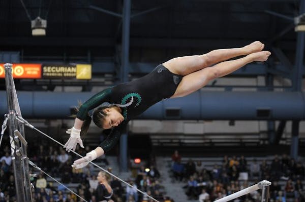 Cottage Grove's Kasondra Tulloch competed on the uneven parallel bars during a Minnesota State Girls Gymnastics tournament on February 26th at the Spo