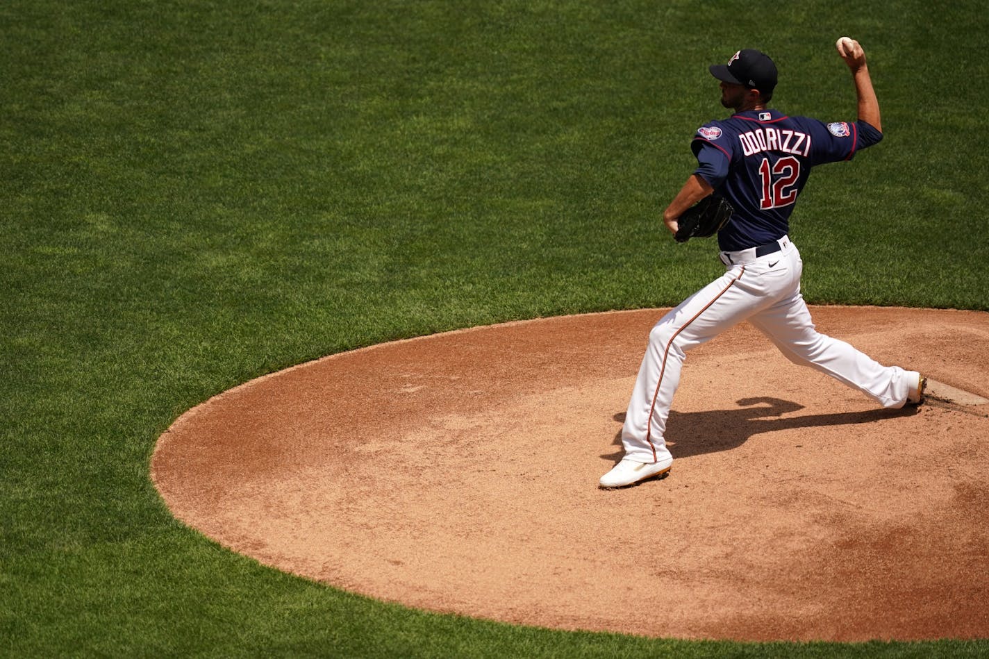 Minnesota Twins pitcher Jake Odorizzi (12) delivered a ball from the mound during live batting practice Saturday.