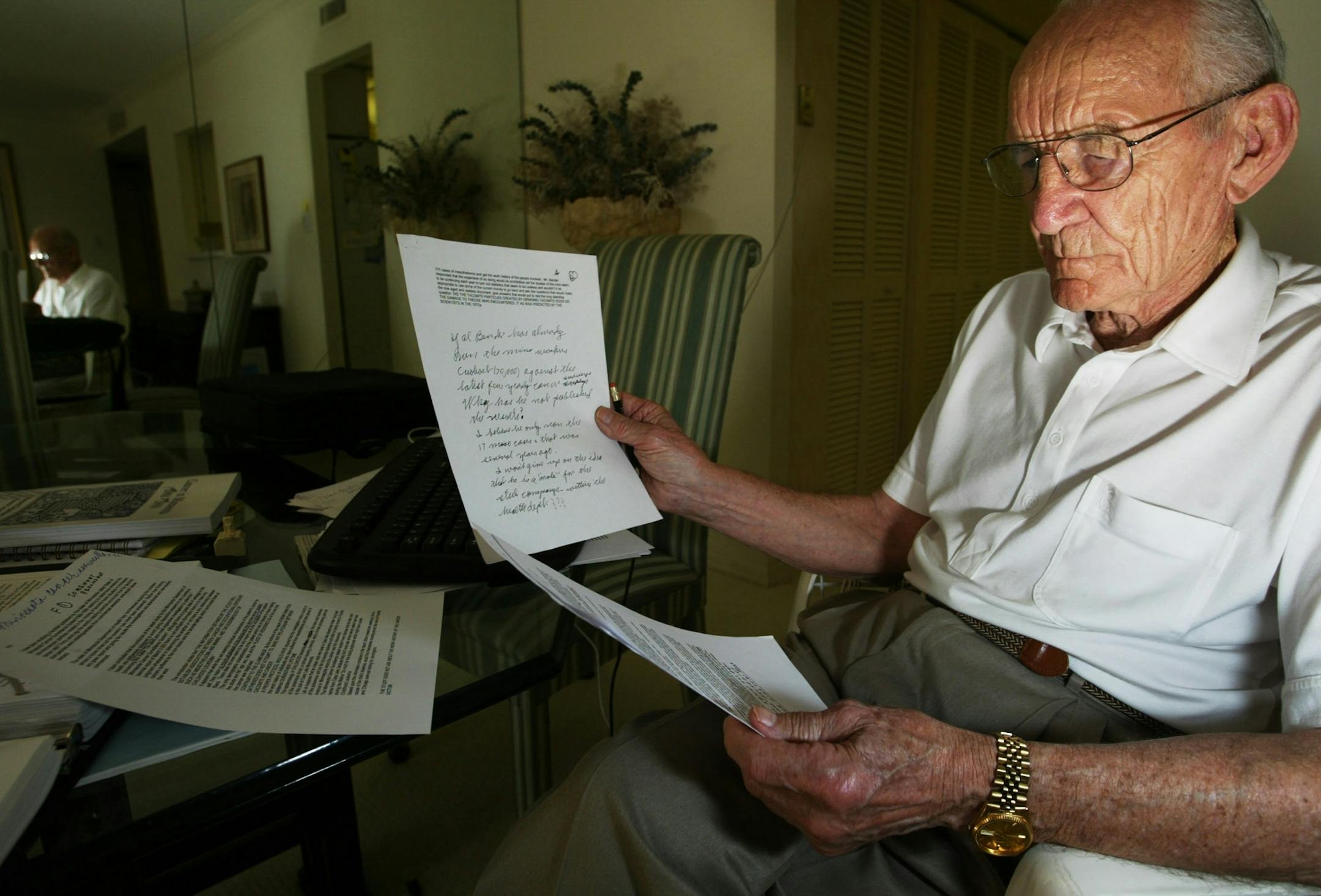 Ft. Myers, FL;3/4/04;left to right:In his condo in Naples, Miles Lord studies evidence that will help him in a case by iron range miners who developed mesothelioma.