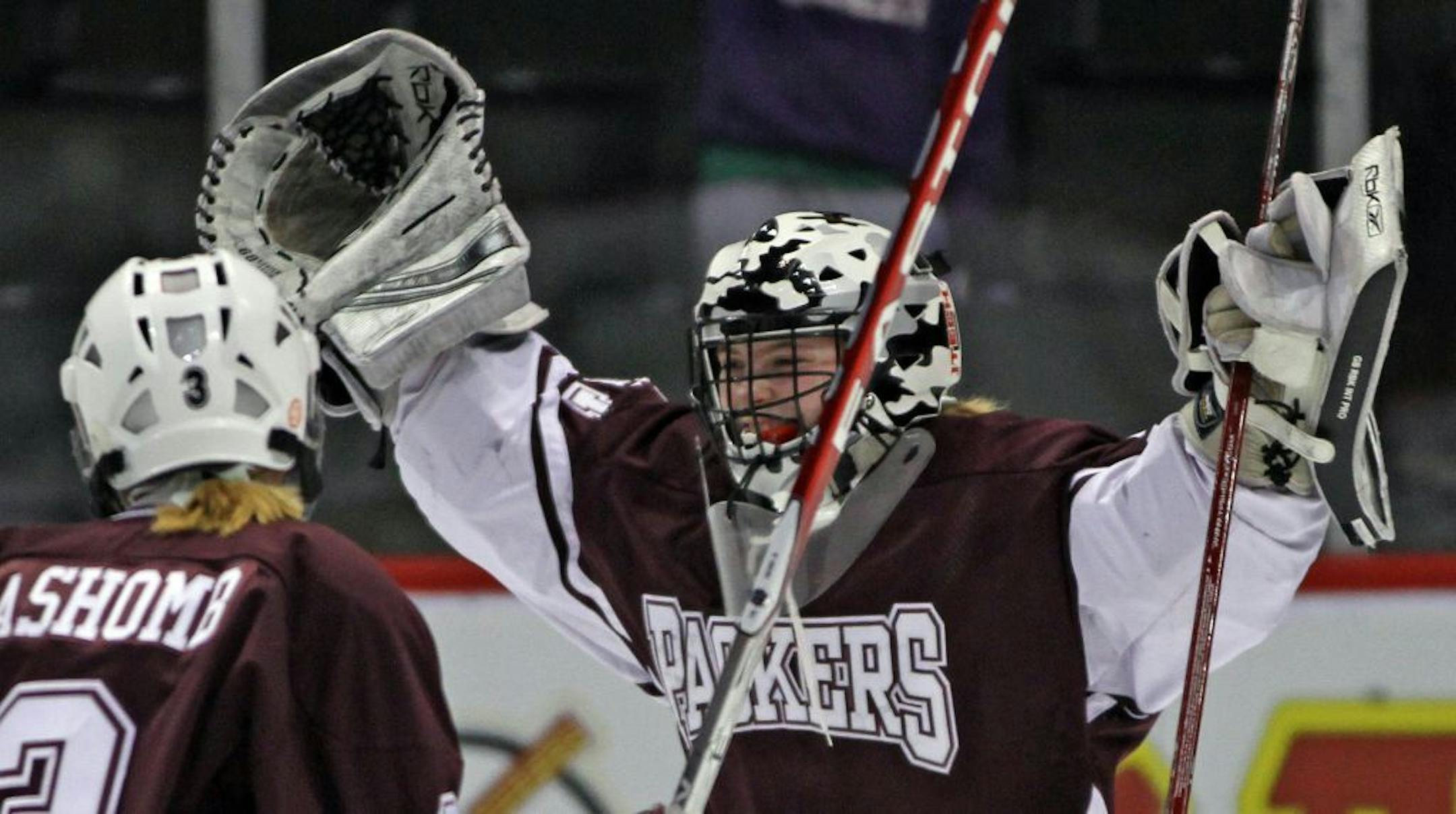 Girls State Hockey Tournament, Class A Semifinals, Warroad vs. South St. Paul, 2/24/12. (right) South St. Paul goalie Sydney Conley celebrated the Packers win over Warroad.