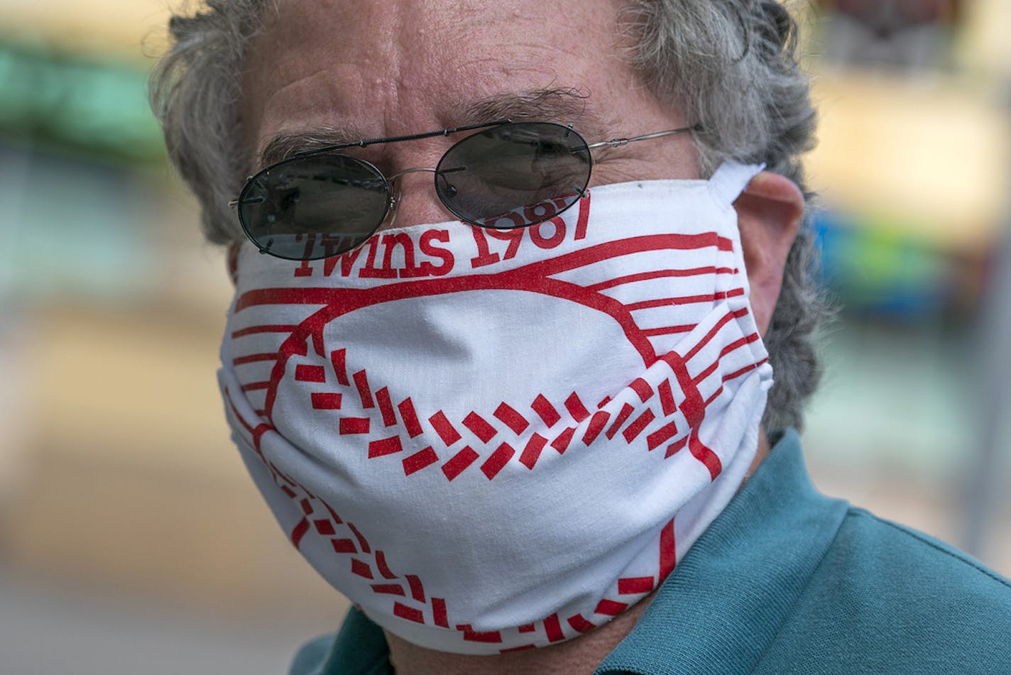 Friday was opening day for Twins fans, but the opener will have no fans. A few fans and season ticket holders showed up at Target Field for free shirt. Season Ticket holder since 1987 Bob Brancale of Hopkins dug his 1987 Homer Hanky out of the moth balls and made a Covid-19 mask while stepping by Target field Friday afternoon. brian.peterson@startribune.com Minneapolis, MN Friday, July 24, 2020