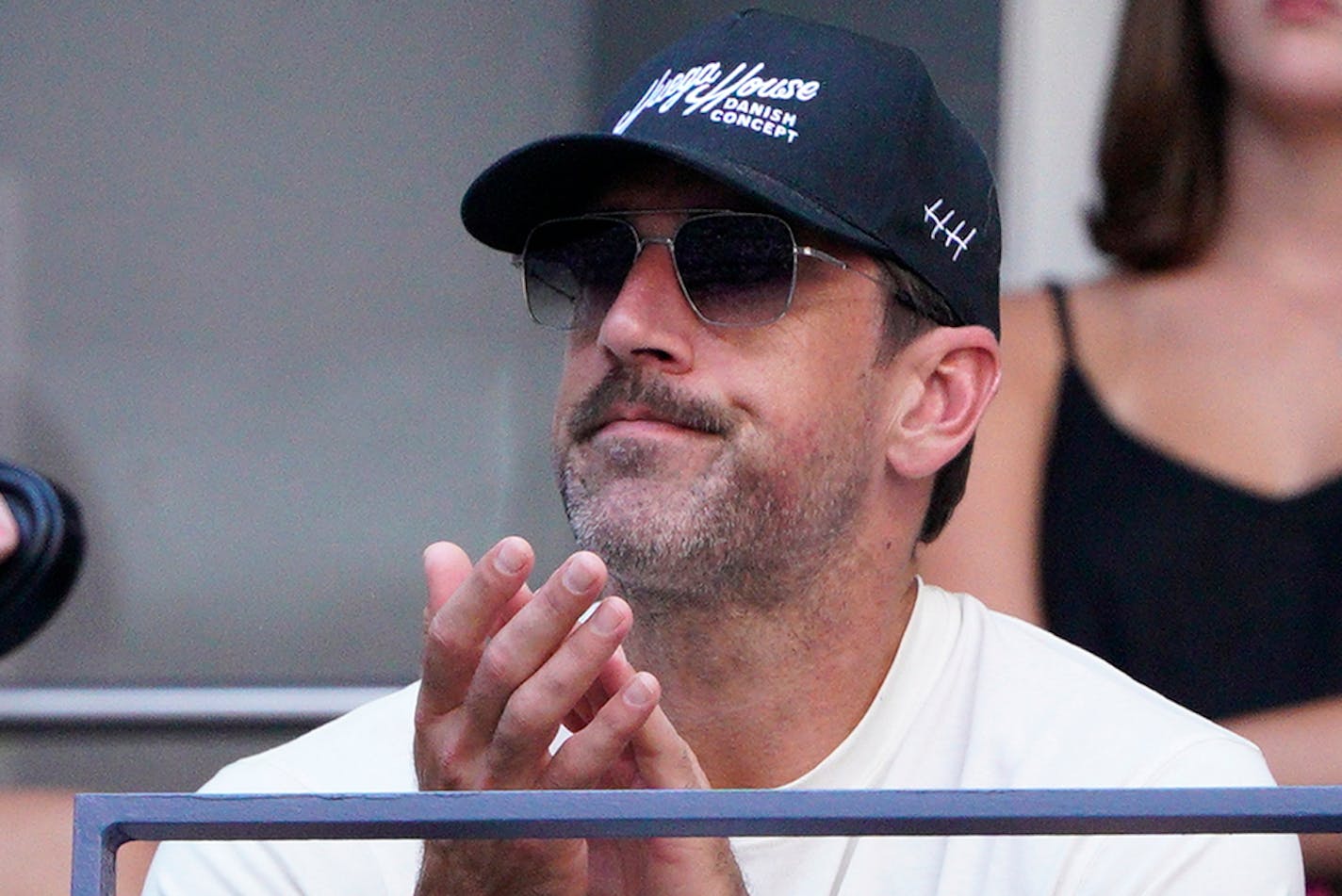 New York Jets quarterback Aaron Rodgers watches Coco Gauff, of the United States, face Caroline Wozniacki, of Denmark, during the fourth round of the U.S. Open tennis championships, Sunday, Sept. 3, 2023, in New York. (AP Photo/Eduardo Munoz Alvarez)