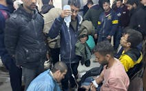 Palestinians wounded in an Israeli strike while waiting for humanitarian aid on the beach in Gaza City are treated in Shifa Hospital on Thursday, Feb.
