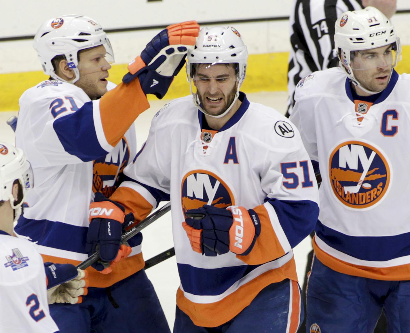 New York Islanders center Frans Nielsen (51), of Denmark, celebrates his first period goal with teammates Nick Leddy (2), Kyle Okposo (21) and John Tavares (91) an NHL hockey game, Tuesday, Feb. 23, 2016, in St. Paul, Minn. (AP Photo/Paul Battaglia)