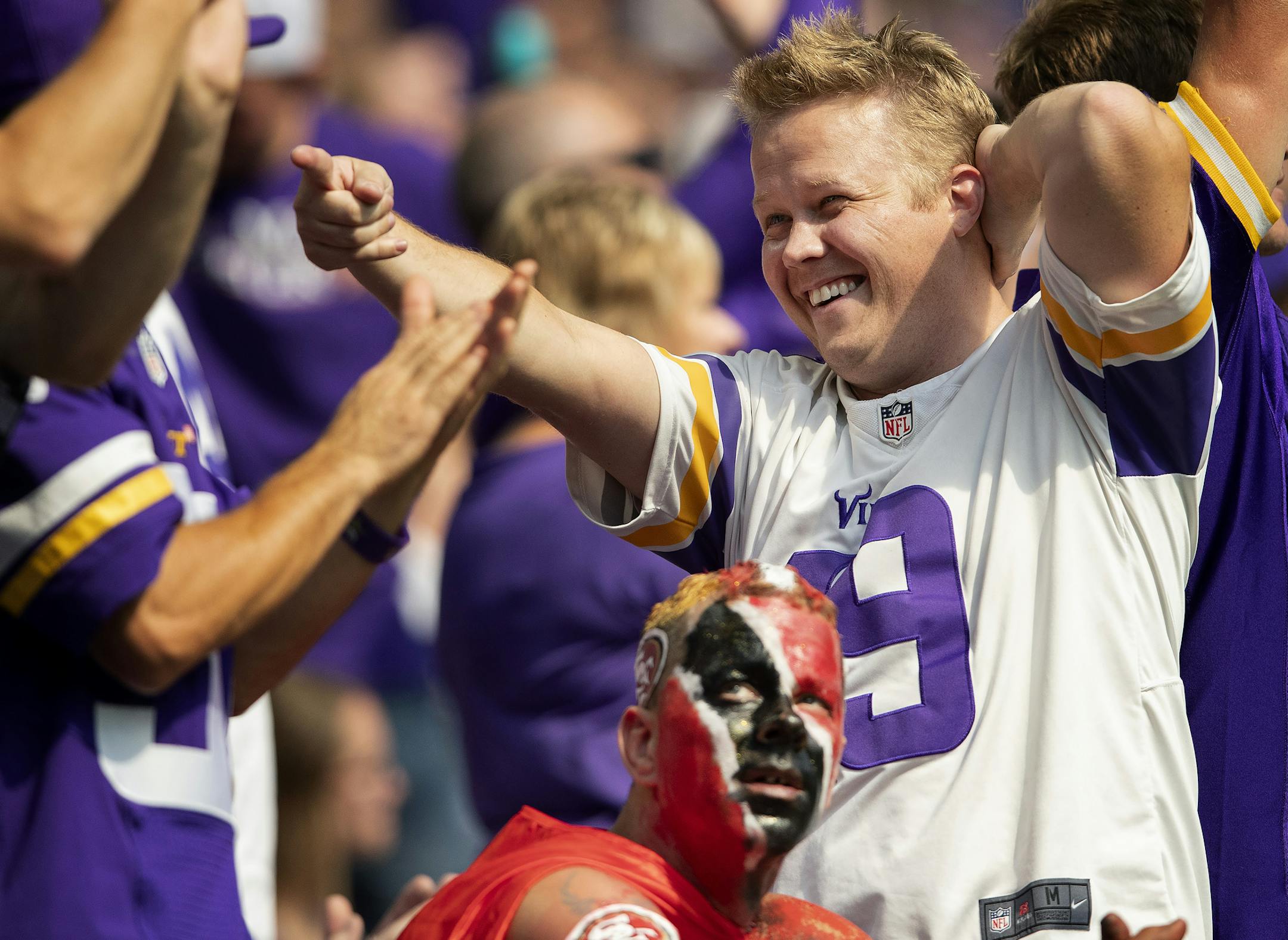 Vikings fan Chris Hannon 32, of Apple Valley cheered as 49ers fan Chris Aiello of Scranton, PA. expressed a different emotion after a Vikings first down in the fourth quarter. ] CARLOS GONZALEZ ï cgonzalez@startribune.com ñ September 9, 2018, Minneapolis, MN, US Bank Stadium, NFL, Minnesota Vikings vs San Francisco 49ers