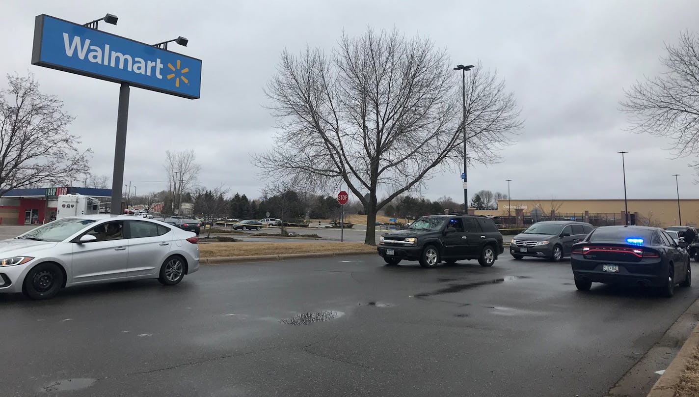 Police remained on scene as customers were allowed to leave the Brooklyn Park Walmart where officers shot a man Monday. He is expected to survive. (Kim Hyatt)