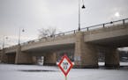 A thin ice sign marks the area under the bridge separating Gray's Bay and Wayzata Bay. ] (Aaron Lavinsky | StarTribune) Over the course of a particula