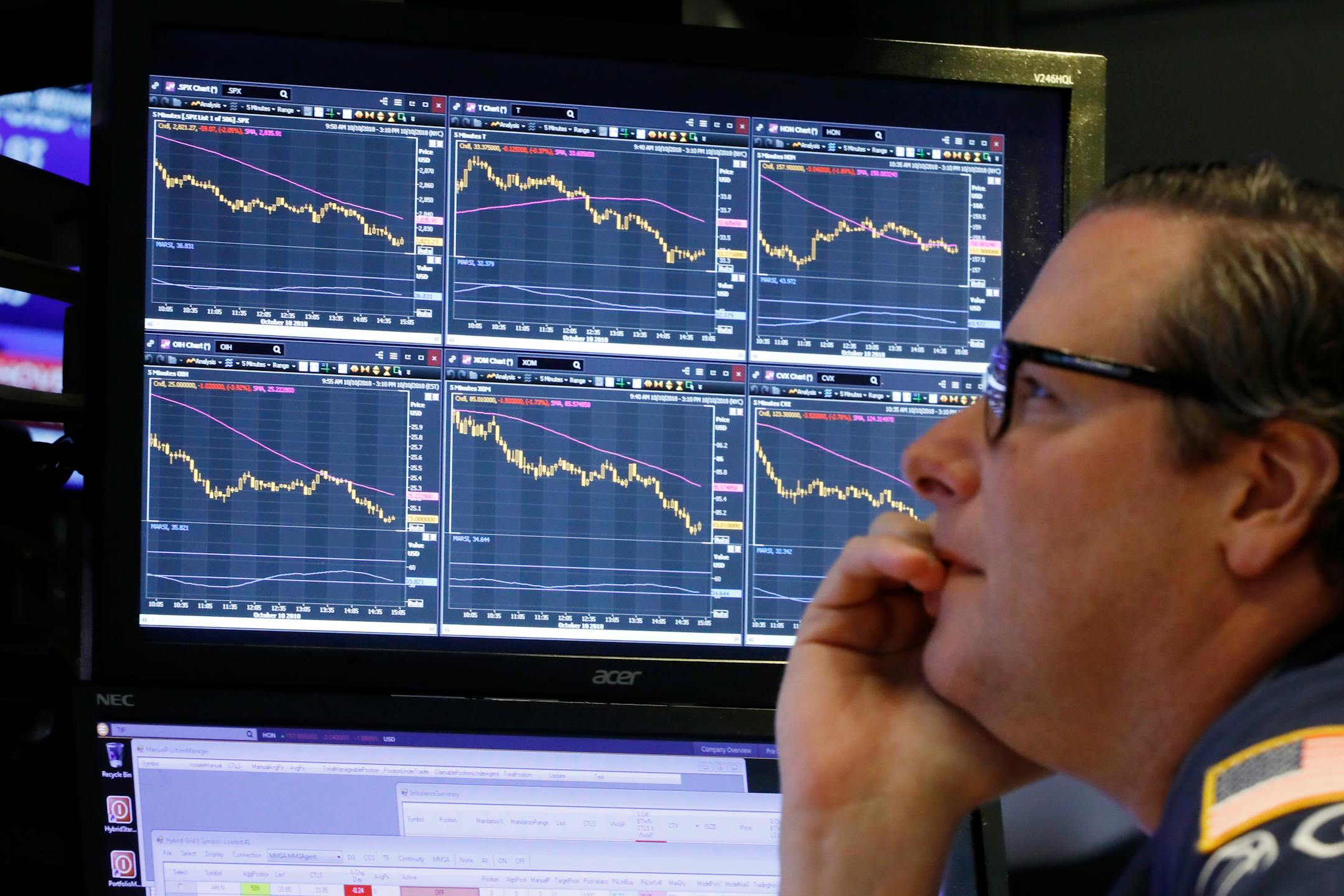 Specialist Gregg Maloney works at his post on the floor of the New York Stock Exchange.