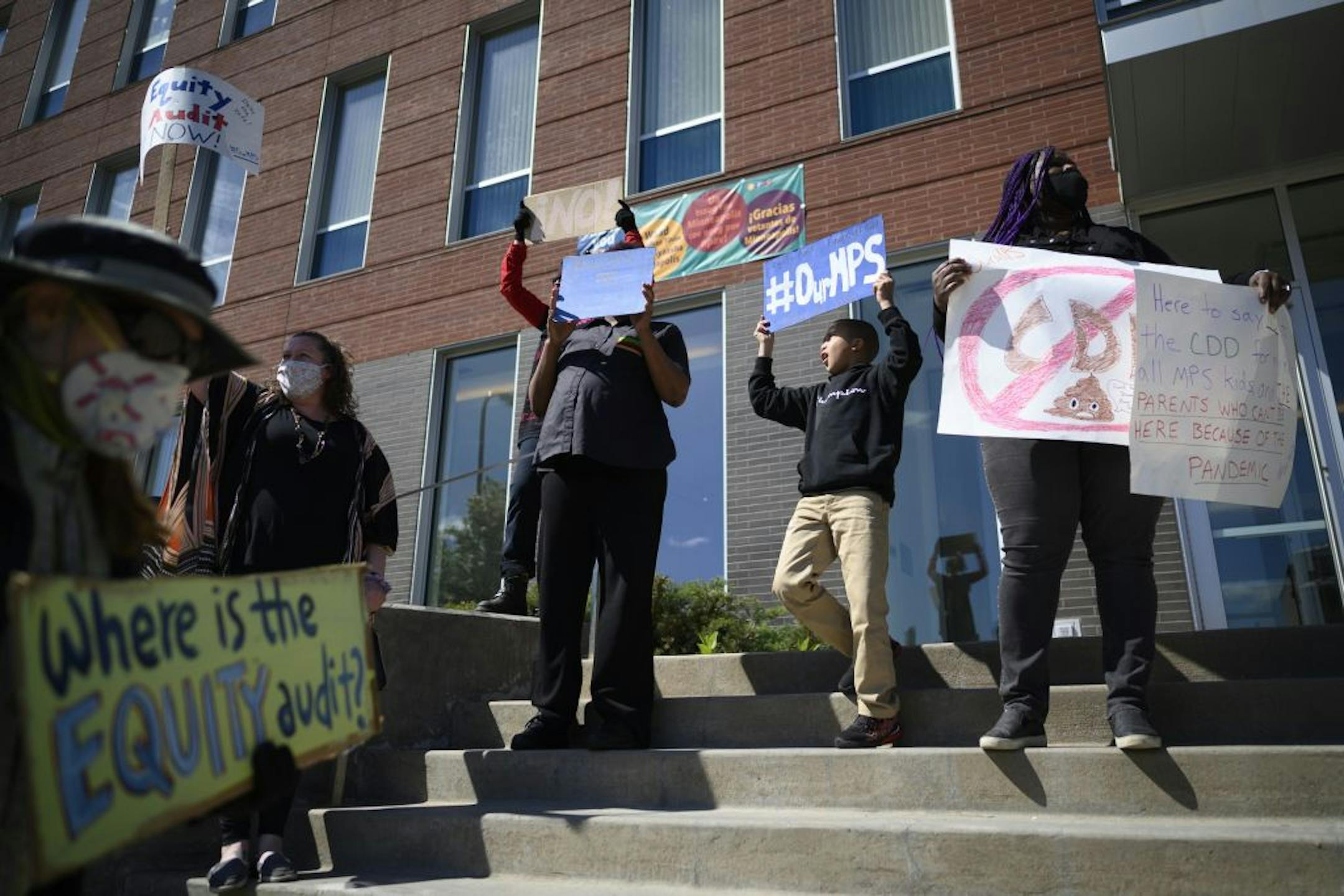 Protesters demonstrated outside the Minneapolis Public School headquarter in North Minneapolis Friday against the CDD plan.