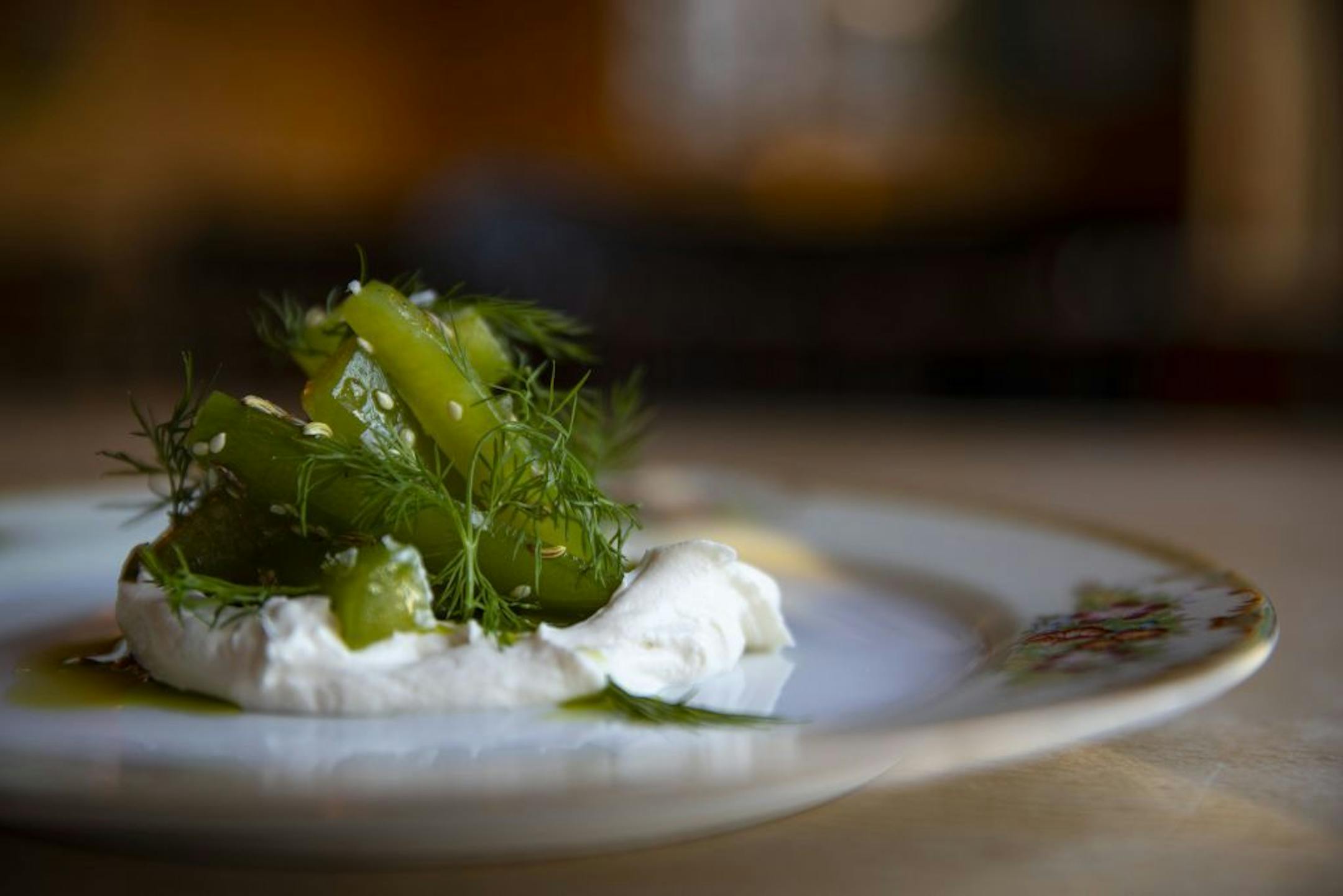 Cucumber with smoked labneh is a signature starter at New Scenic Café.