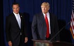 In this Feb. 2, 2012, file photo, then-Republican presidential candidate Gov. Mitt Romney, left, was endorsed by Donald Trump in Las Vegas.