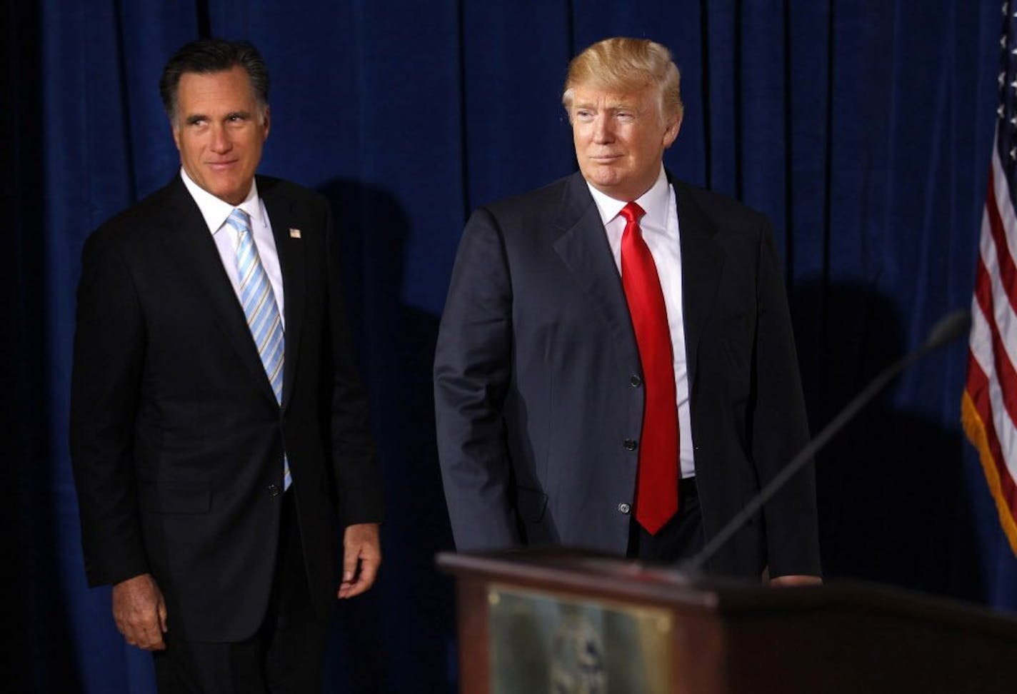 In this Feb. 2, 2012, file photo, then-Republican presidential candidate Gov. Mitt Romney, left, was endorsed by Donald Trump in Las Vegas.