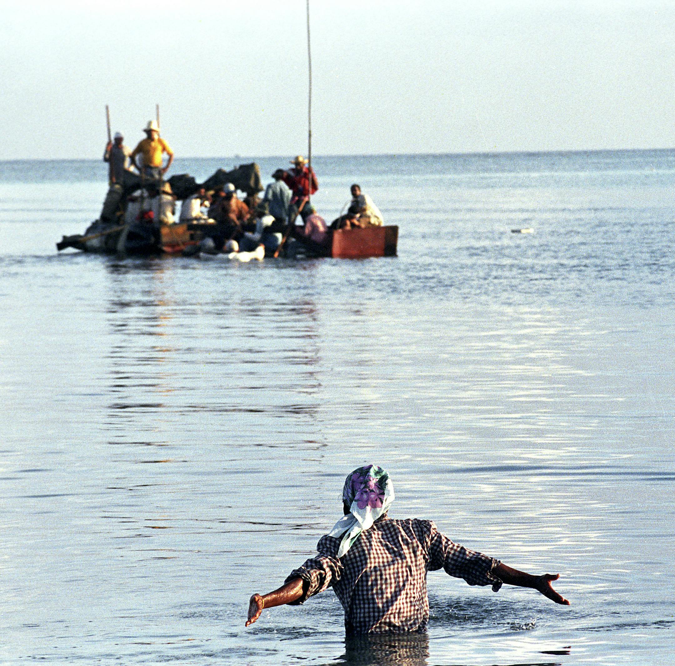FILE — People set out by raft from Las Brisas del Mar when Cuba suffered from shortages of gas, food and medicine, Sept. 12, 1994. On Dec. 17, 2014, the gulf between the U.S. and Cuba shrank again when President Barack Obama announced the re-establishment of diplomatic ties between the two countries and a move to liberalize travel, exports, communication and banking rules. (Angel Franco/The New York Times)