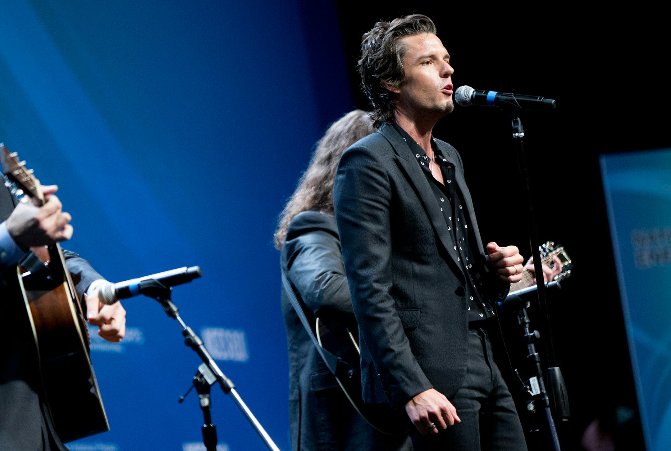 Musician with the band The Killers Brandon Flowers performs before President Barack Obama speaks at the National Clean Energy Summit at the Mandalay Bay Resort Convention Center, Monday, Aug. 24, 2015, in Las Vegas. The President used the speech to announce a set of executive actions and private sector commitments to accelerate America&#xed;s transition to cleaner sources of energy and ways to cut energy waste. (AP Photo/Andrew Harnik) ORG XMIT: OTKAH