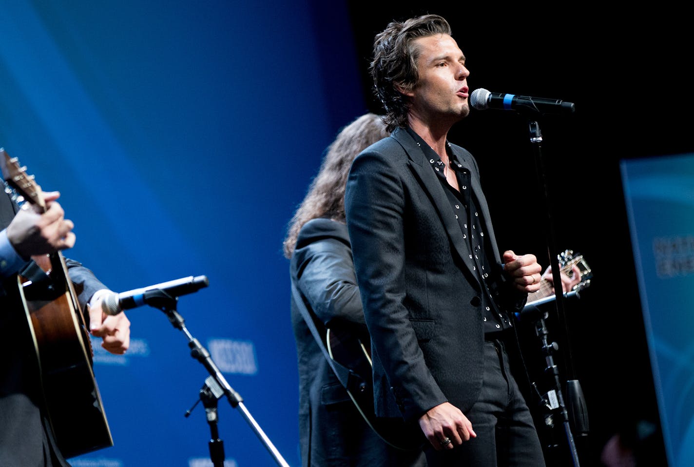 Musician with the band The Killers Brandon Flowers performs before President Barack Obama speaks at the National Clean Energy Summit at the Mandalay Bay Resort Convention Center, Monday, Aug. 24, 2015, in Las Vegas. The President used the speech to announce a set of executive actions and private sector commitments to accelerate America&#xed;s transition to cleaner sources of energy and ways to cut energy waste. (AP Photo/Andrew Harnik) ORG XMIT: OTKAH