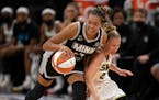 Minnesota Lynx forward Napheesa Collier (24) got control of the ball after forcing Chicago Sky guard Courtney Vandersloot (22) to turn it over in the 