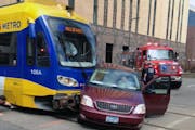A light rail train struck a car Sunday afternoon, April 12, 2015, in downtown Minneapolis, leaving the tracks blocked. The collision occurred about 12
